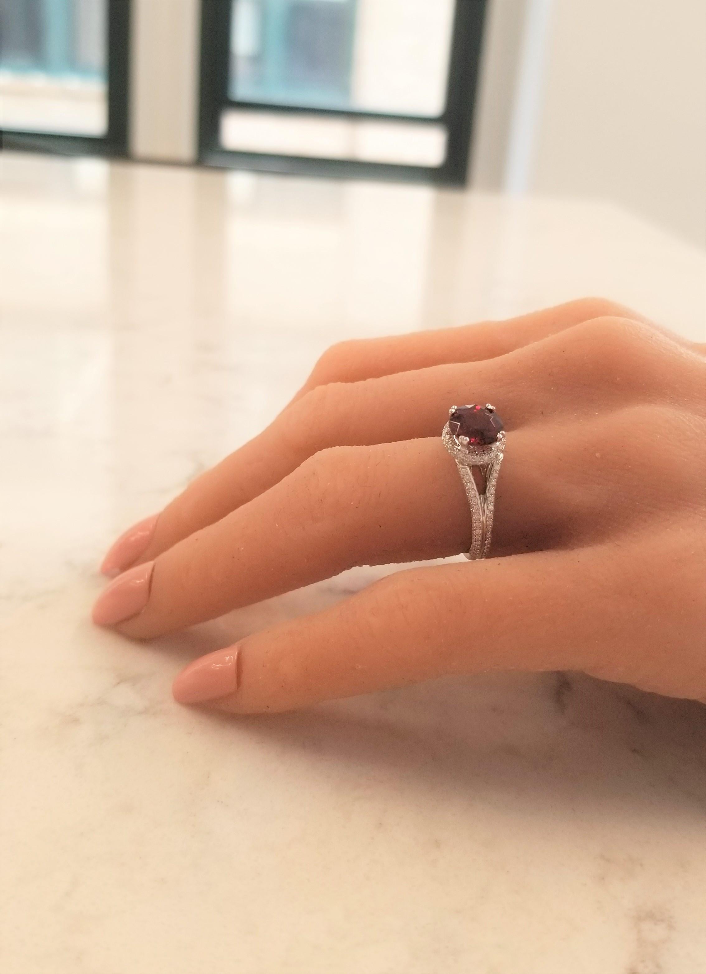 Let me introduce you to the gemstone Spessartite garnet. It is a stunning gemstone that is loaded with personality and rich, deep warm color. This ring is brilliantly showcased in an 18 karat white gold setting that features 0.60 carat total weight