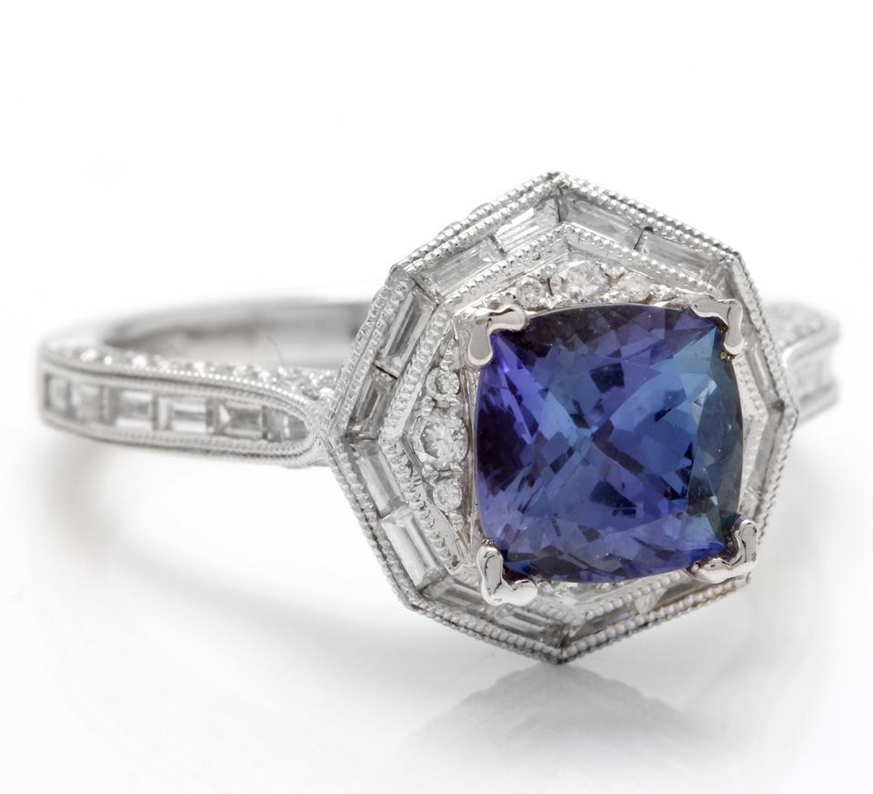 2.35 Carats Natural Very Nice Looking Tanzanite and Diamond 18K Solid White Gold Ring

Total Natural Cushion Cut Tanzanite Weight is: Approx. 1.50 Carats

Tanzanite Measures: Approx. 7.00 x 7.00mm

Natural Round Diamonds Weight: Approx. 0.85 Carats