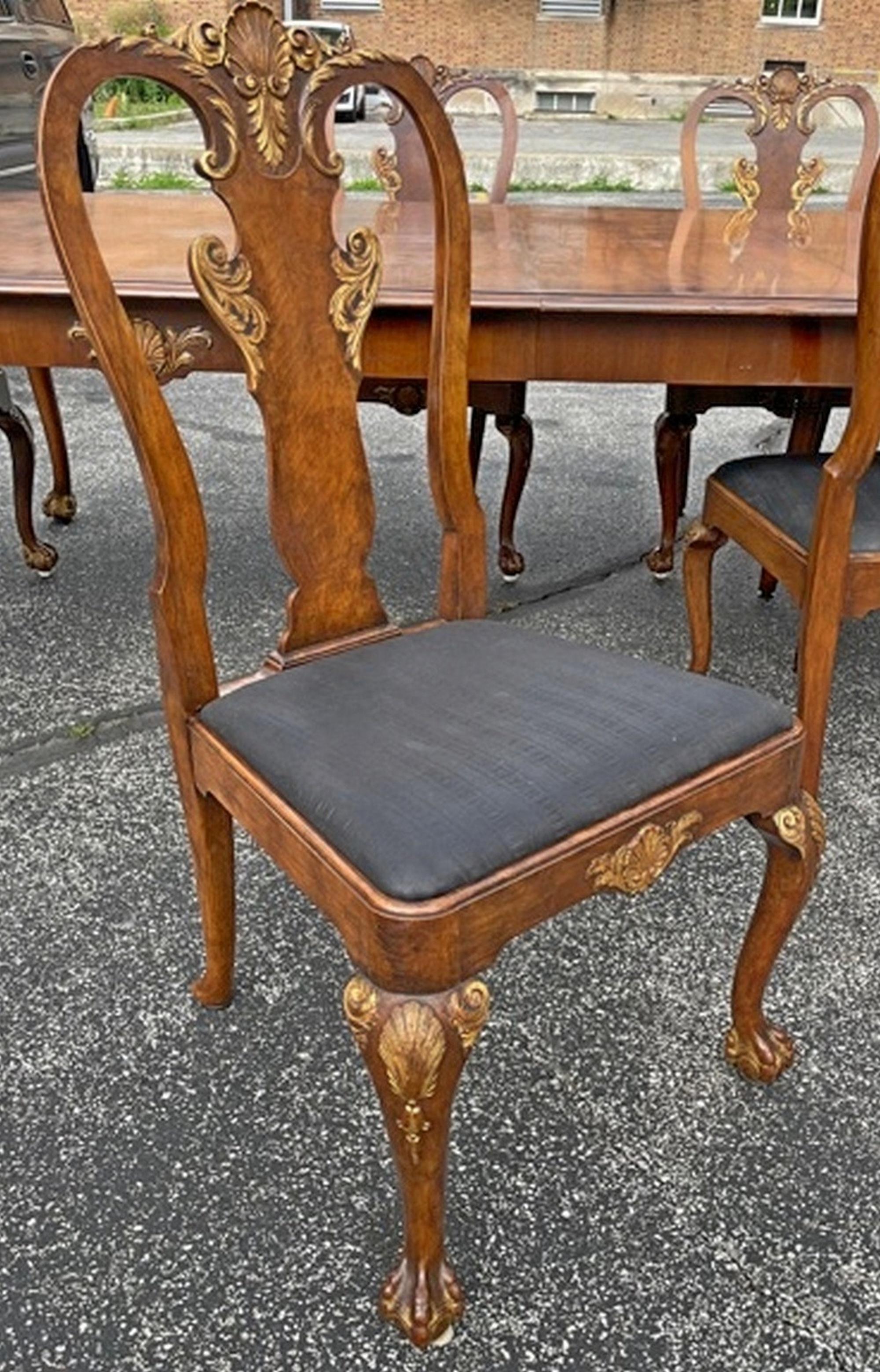 23.5 Feet extra long walnut chippendale conference dining table with 16 chairs and 10 leaves. circa 1890. American walnut with Burlwood inlay. Ball and claw feet with a center pedestal and additional drop down legs on each end. 10 Leaves, some are