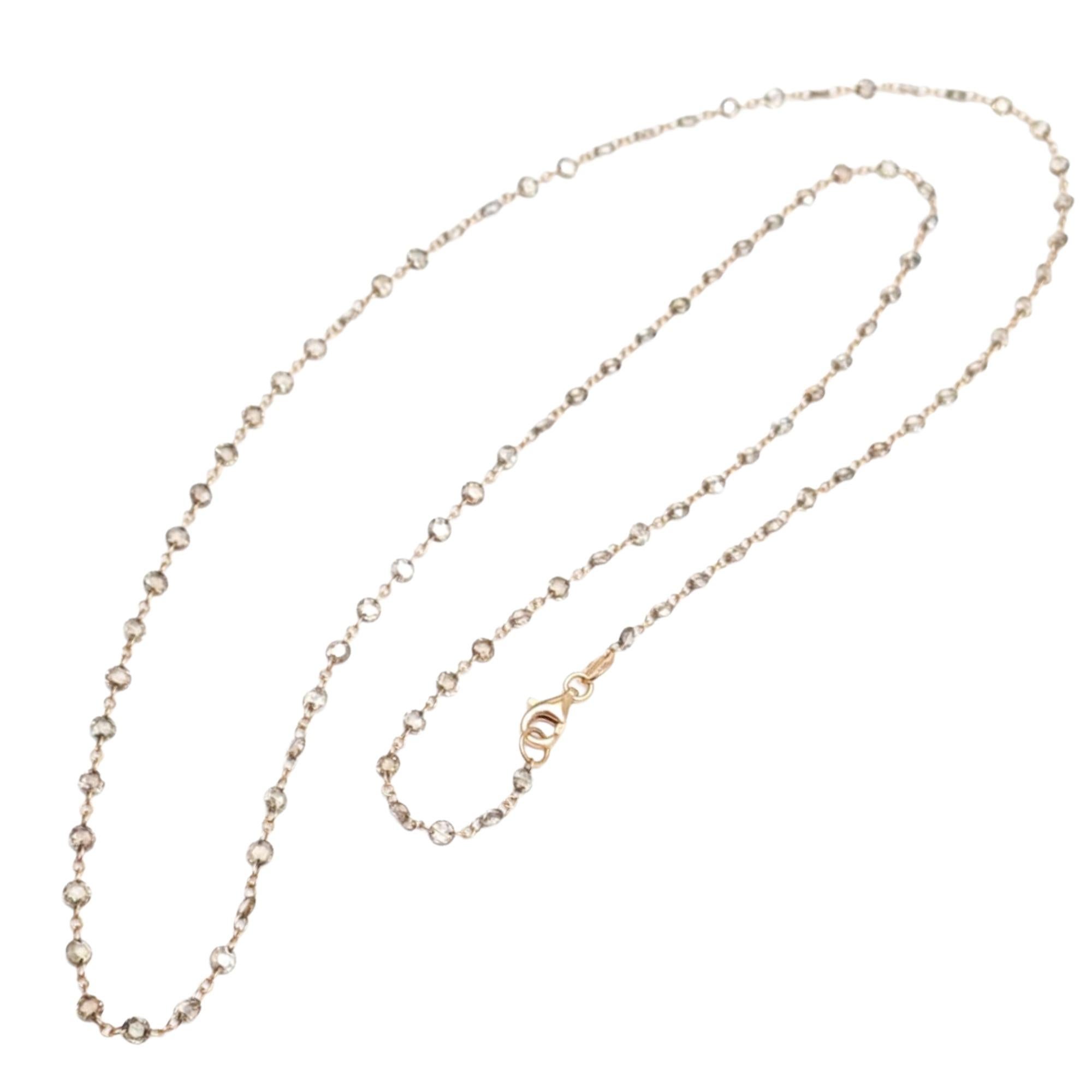 A refined essential with effortless sparkle. This delicate 18 karat yellow gold necklace features faceted brown diamond rose cuts linked together and spaced gracefully along the chain, creating a soft shimmer with every movement. Elegant, timeless,