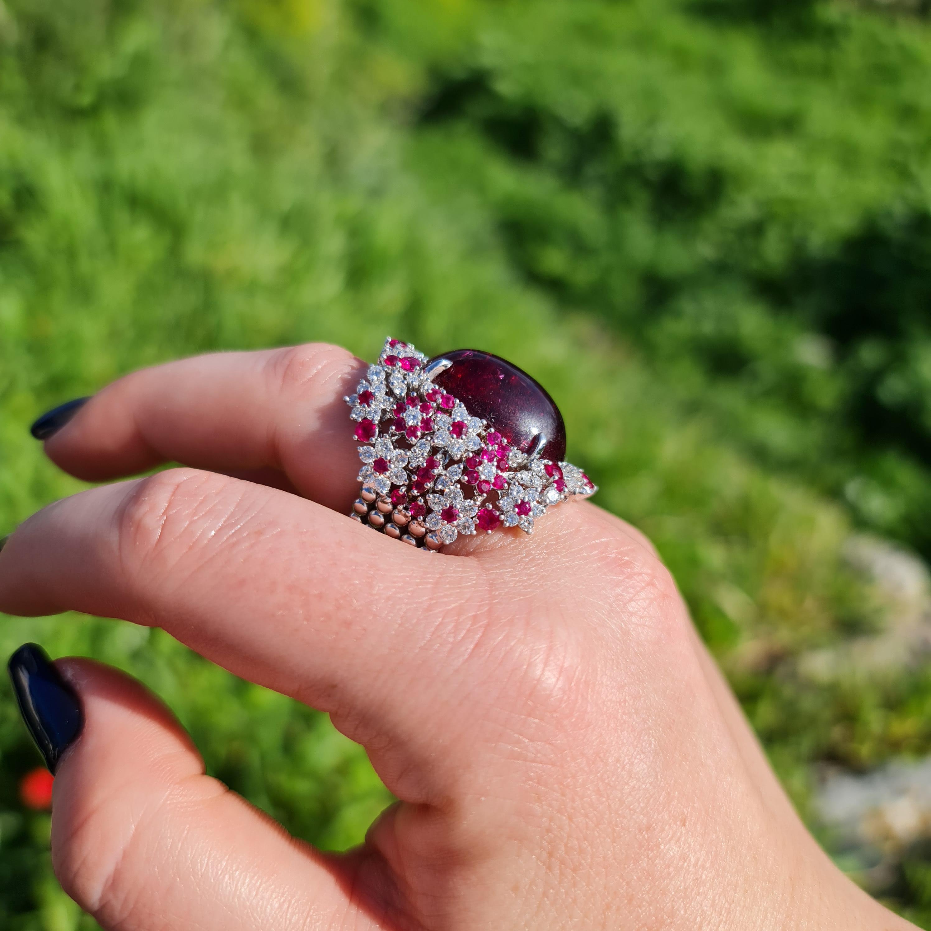 This gorgeous natural rubellite ring will impress everyone around you. It features a large oval 23.52 carat gemstone, adorned with 2.56 carat natural diamonds and 2.60 carat natural ruby. One of a kind

Come with GRS Certificate
Ring Material: 18K