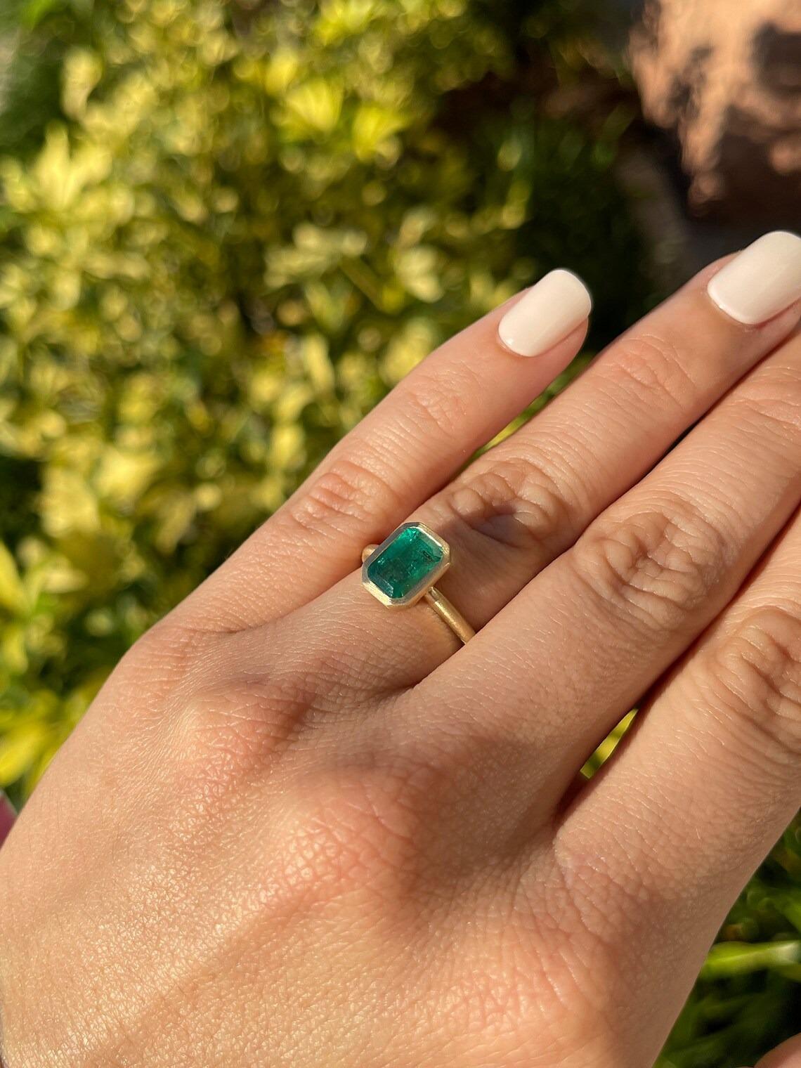 dark green emerald engagement rings