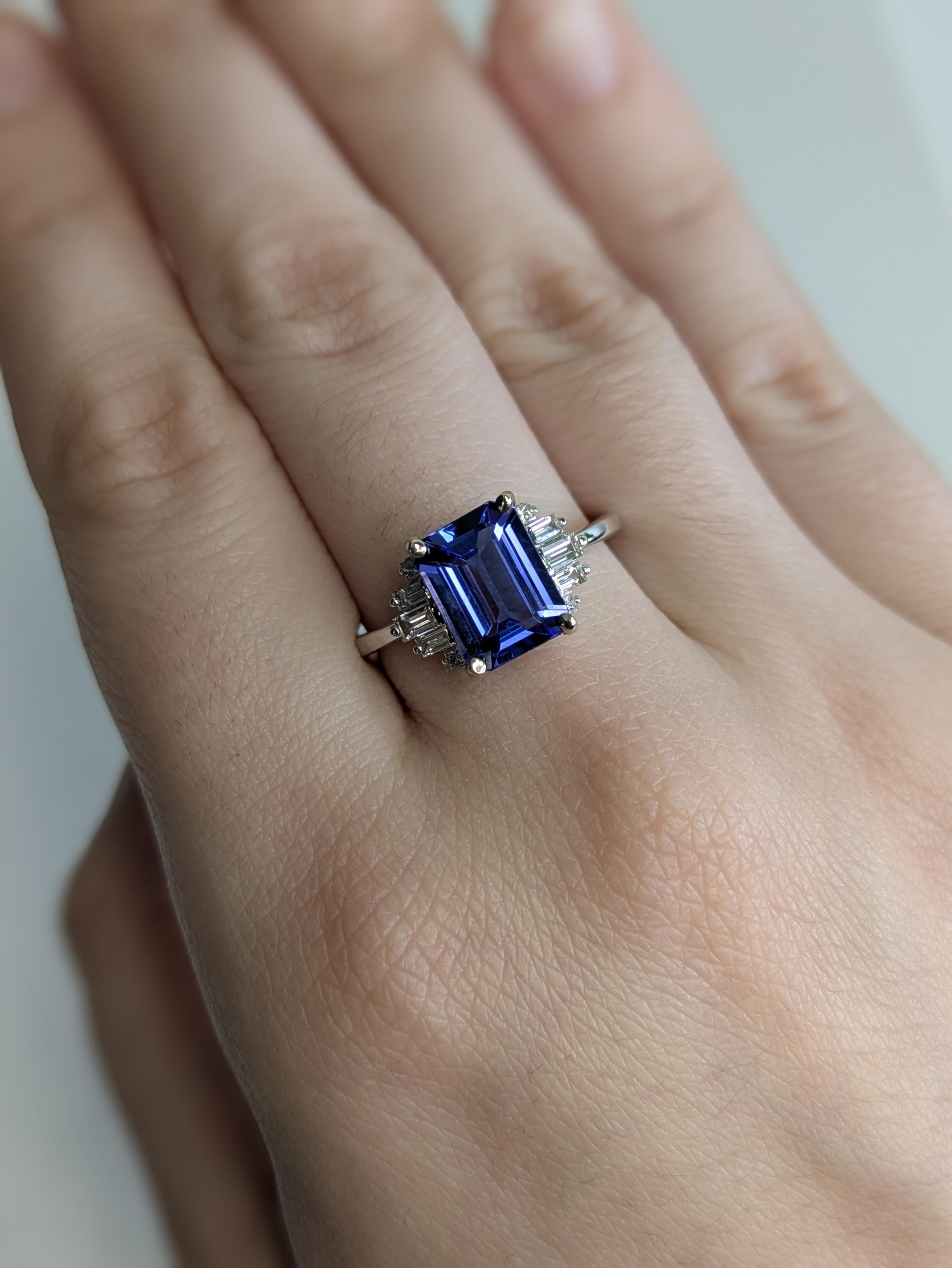 Rich in color and luxury, this 2.35 carat tanzanite ring is framed by earth-mined baguette diamonds. Set in solid 14k white gold, it’s a refined choice for any occasion.

