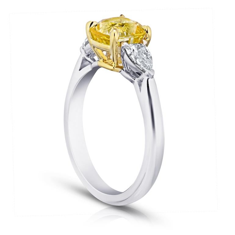 2.36 carat cushion (natural no heat) yellow sapphire with arrow shaped diamonds .46 carats set in a platinum ring.
