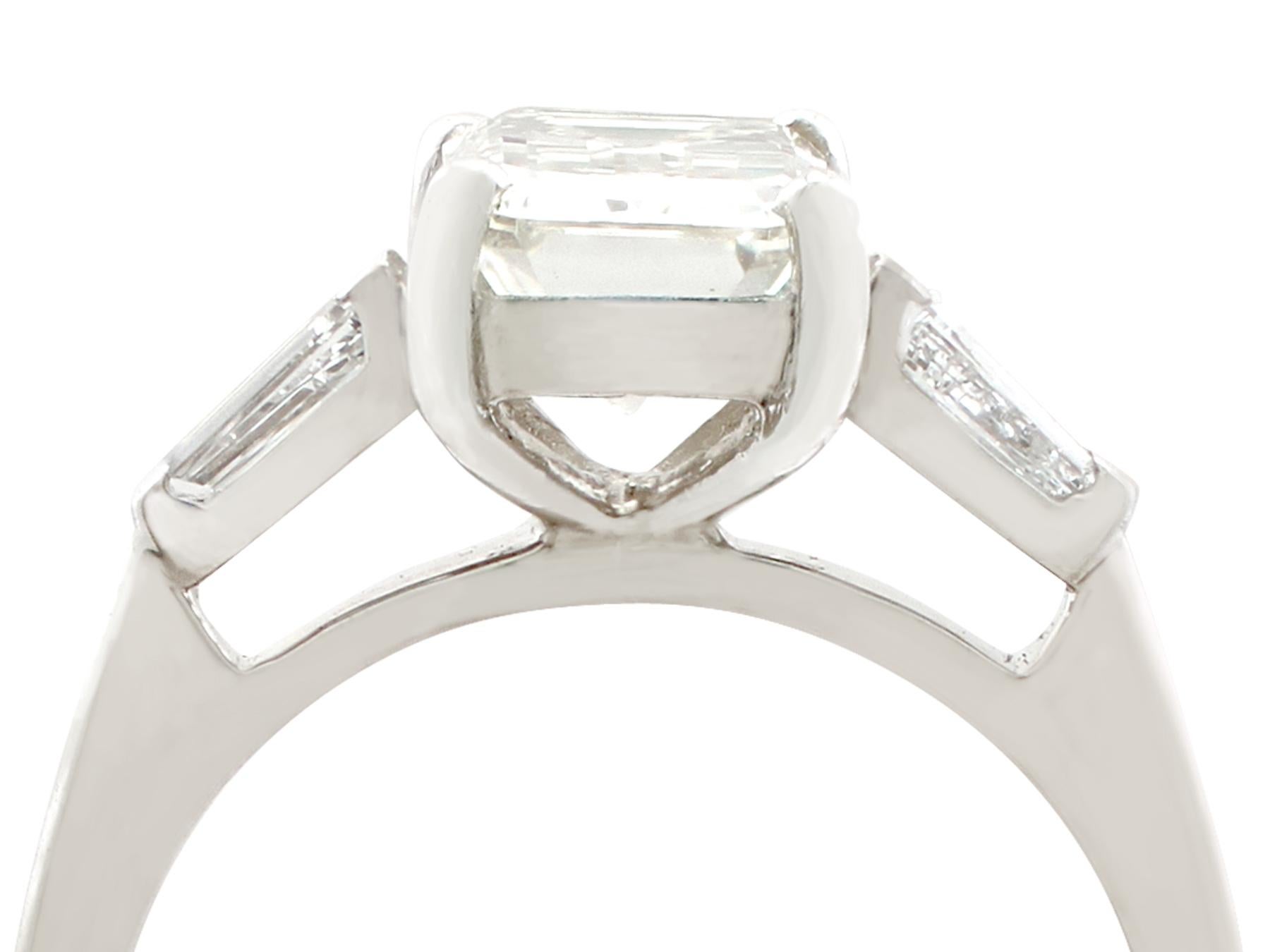 A stunning vintage 2.36 carat diamond and platinum solitaire style engagement ring; part of our diverse diamond and estate jewelry collections.

This stunning, fine and impressive emerald cut diamond ring with baguettes has been crafted in