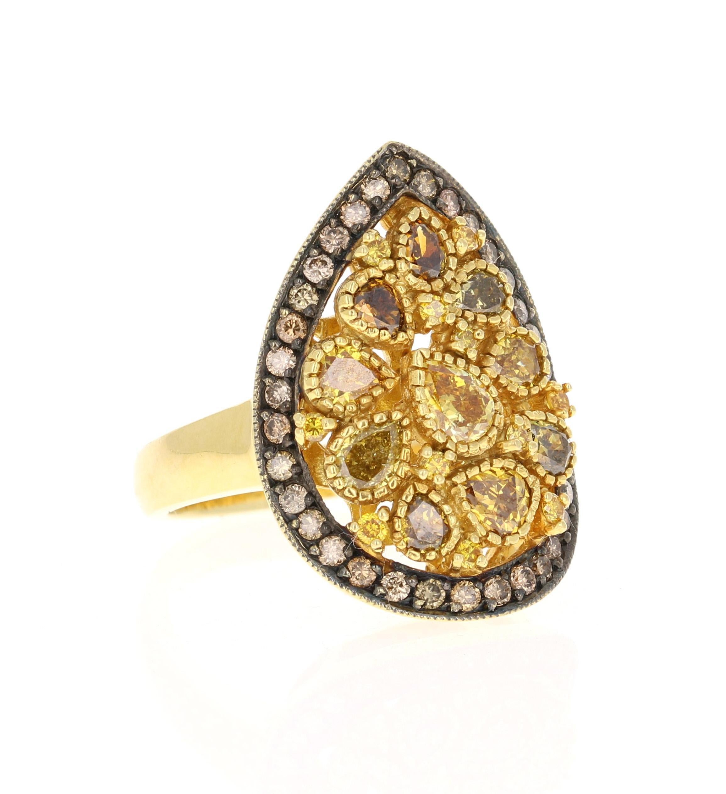 This ring has Natural Fancy Color Diamonds that weigh 1.87 carats and Natural Round Cut Brown Diamonds that weigh 0.49 carats. The clarity of the diamonds are VS2. The natural fancy color diamonds are pear cuts that range in natural colors of