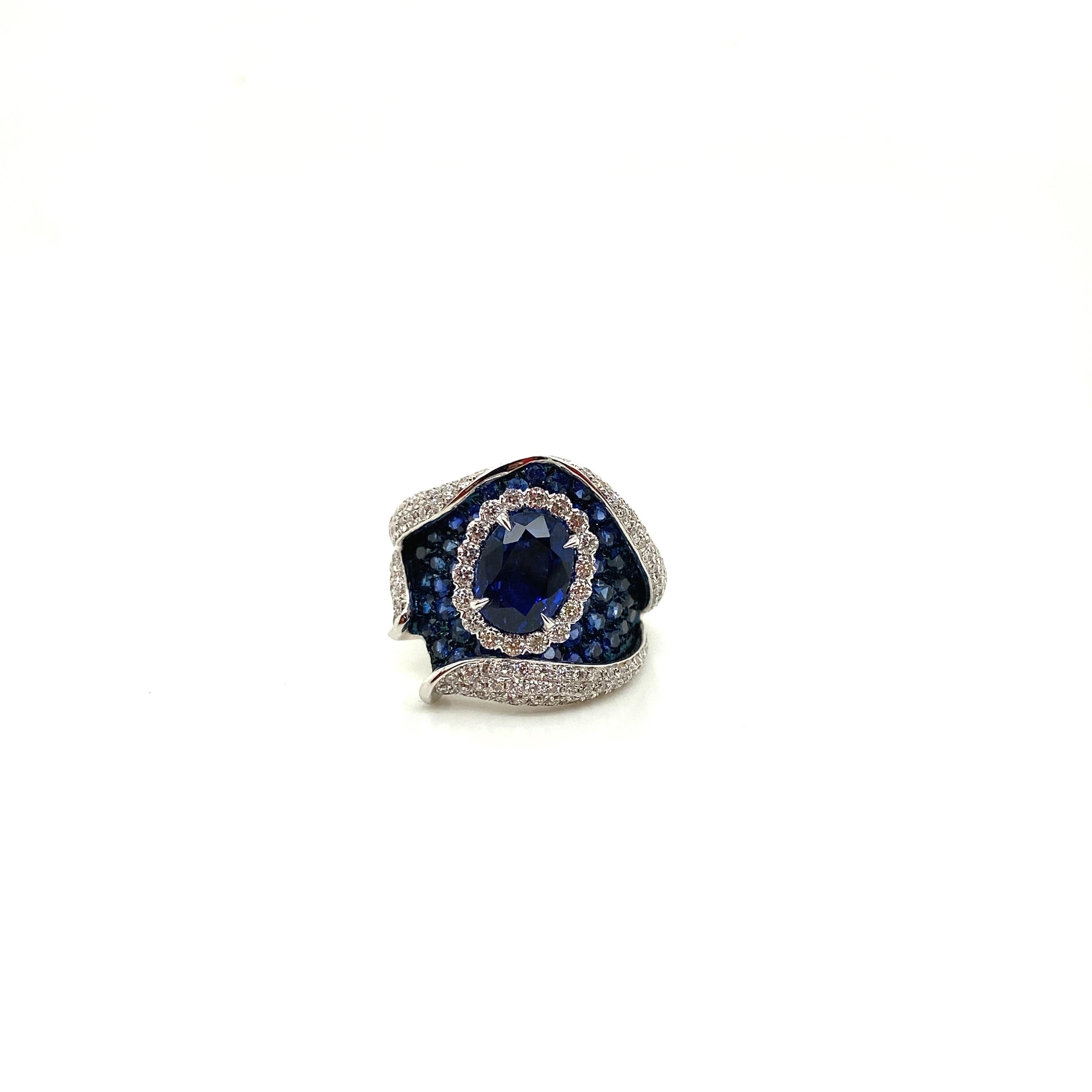 2.36 Carat Natural Oval-Cut Royal Blue Sapphire and White Diamond Gold Ring:

A stylish ring, it features a gorgeous natural oval-cut royal blue sapphire weighing 2.36 carat surrounded by a halo of white round brilliant-cut diamonds craftily