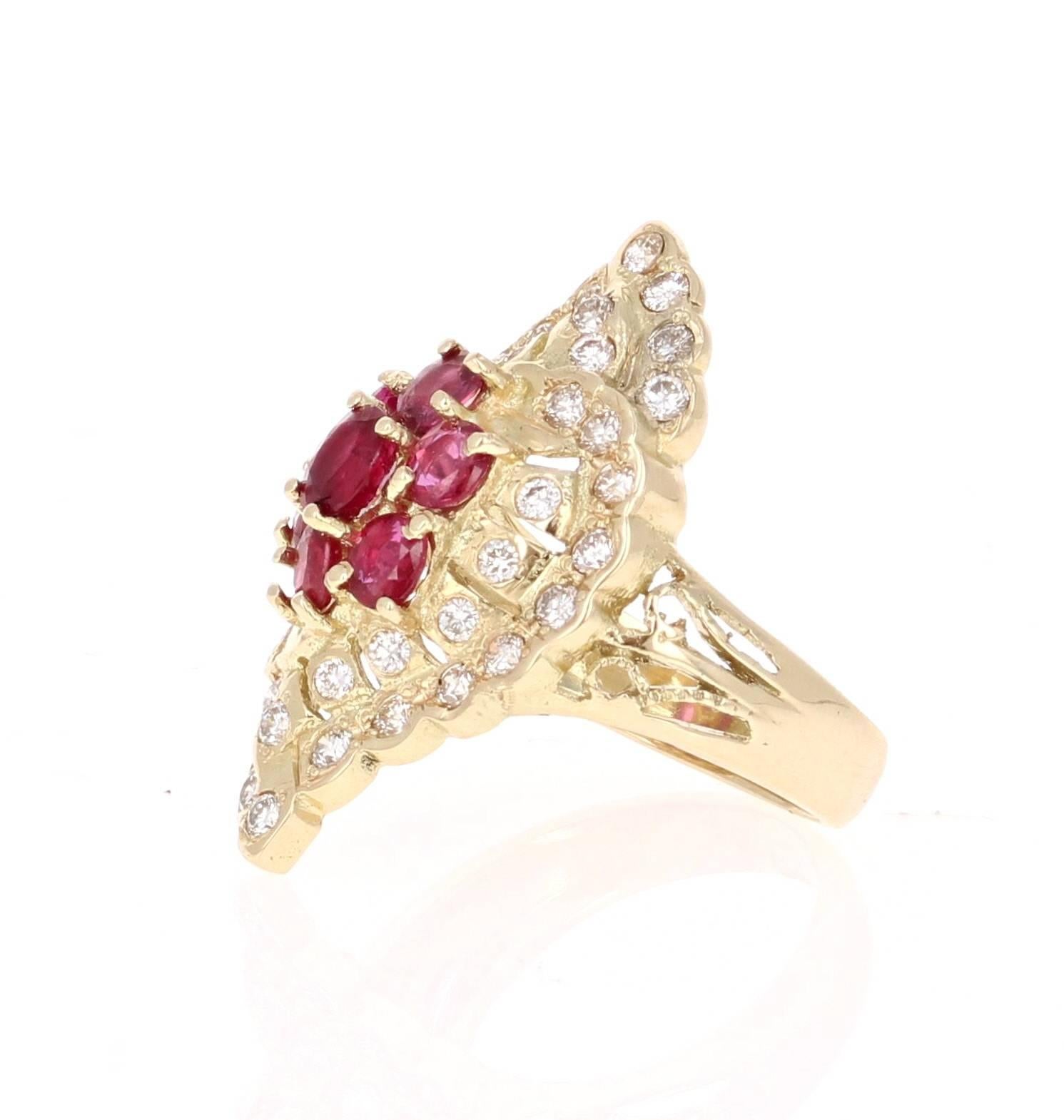 This Art-Deco Inspired Ring is truly a unique vintage beauty! 
There are 7 Oval Cut Burmese Rubies clustered into a flower like design in the center of the ring that weigh 1.46 carats.  There are also 40 Round Cut Diamonds that weigh 0.90 carat