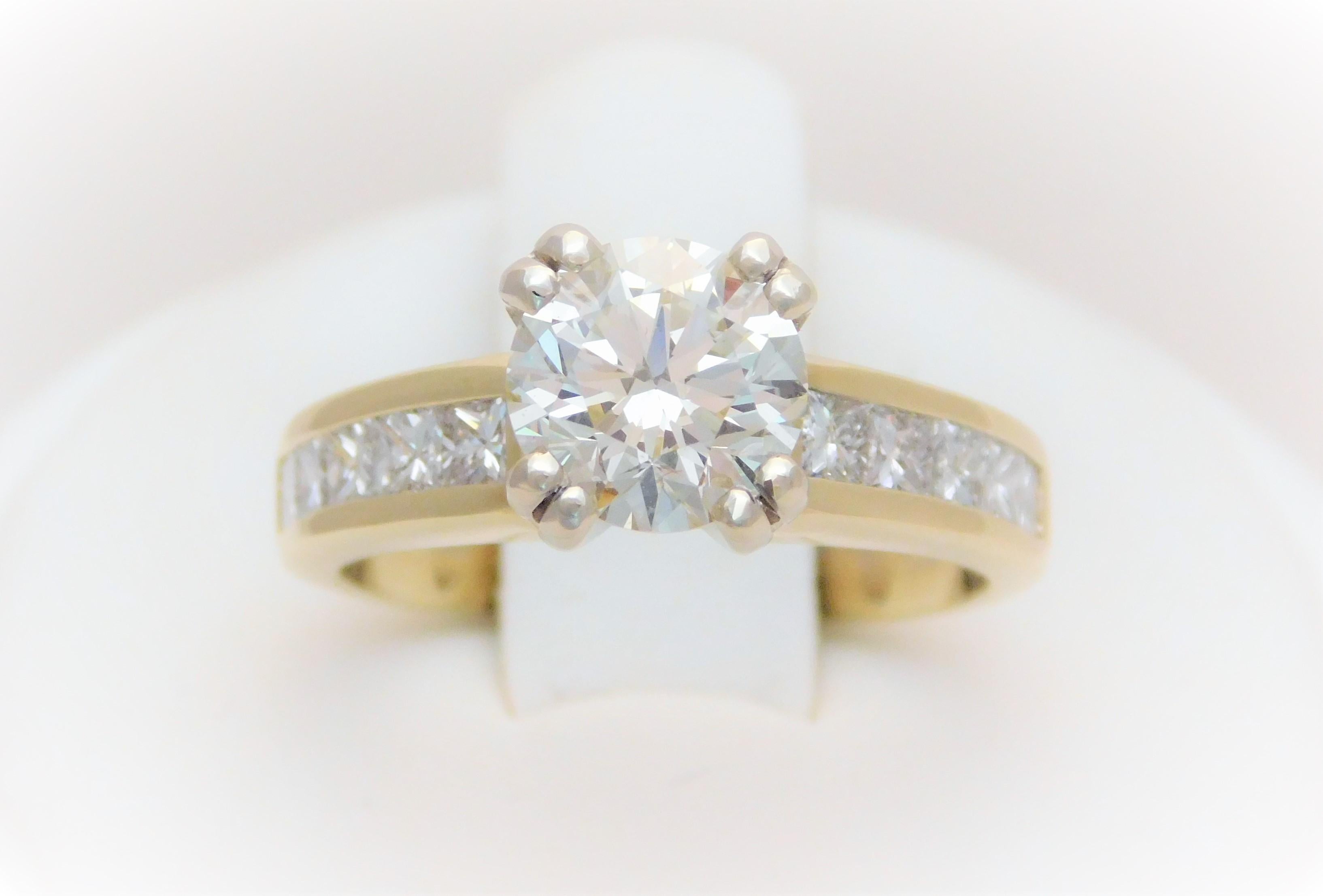 From an elegant New Orleans estate.  This stunning diamond engagement ring has been crafted in solid 14k gold.  It has been masterfully set, in a four double-prong setting, with an incredibly vibrant Natural round brilliant-cut 1.71ct diamond as its