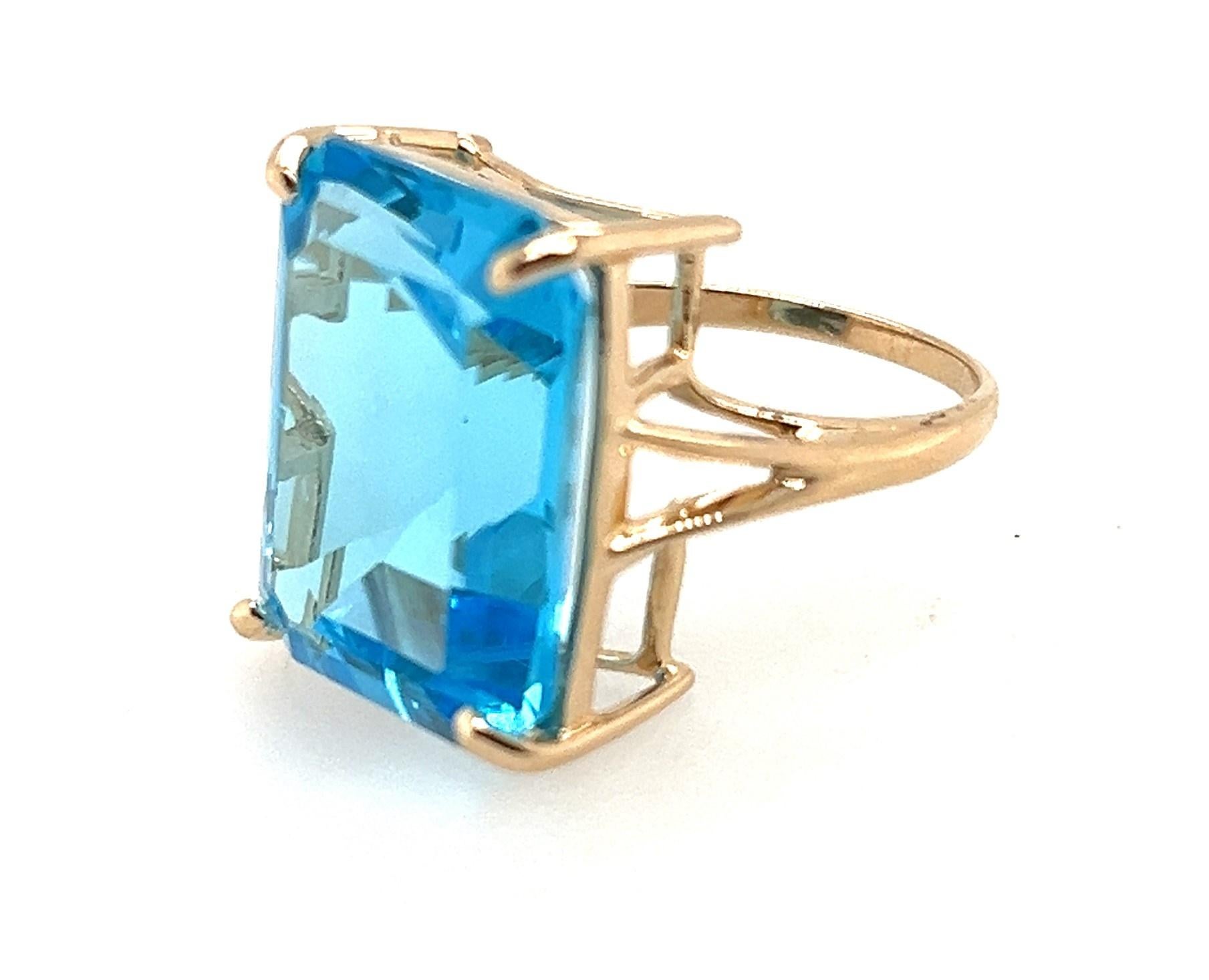 Emerald Cut 23.66 Carat Blue Topaz Ring In 14kt Gold  For Sale