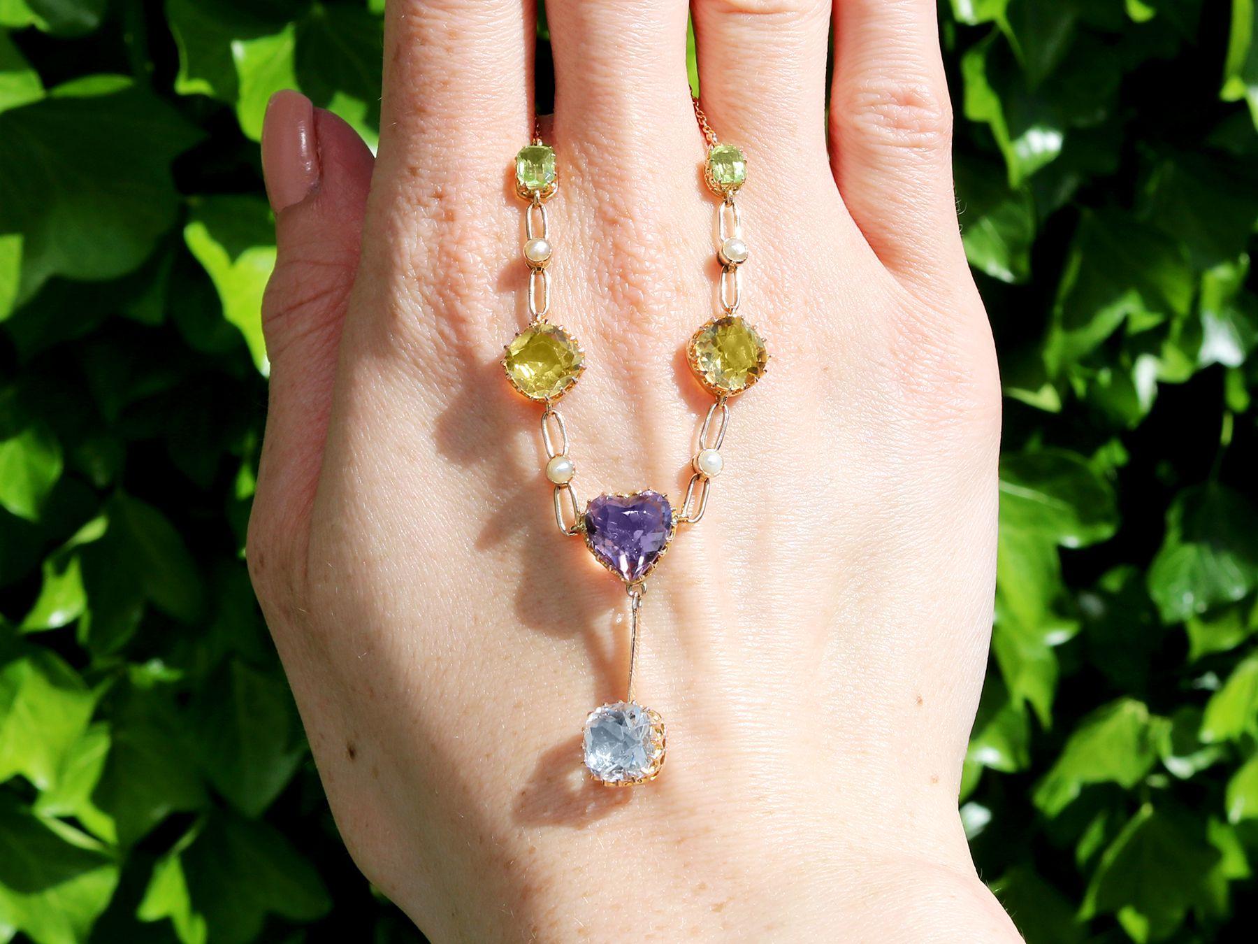 A stunning, fine and impressive 2.36 carat aquamarine, 3.71 carat citrine, 2.10 carat amethyst, 0.80 carat peridot and seed pearl, 12 karat yellow gold necklace; part of our diverse antique jewelry and estate jewelry collections.

This stunning,