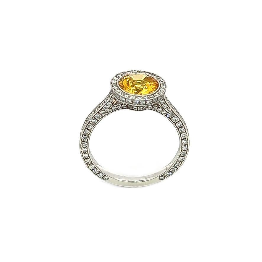 This exquisite piece showcases a stunning 1.34CTpphire nestled in an Art Deco-inspired setting. The sides, top, and bottom boast an impressive 1.02CT of Round Brilliant Diamonds, while the band is expertly crafted from platinum. It's a truly
