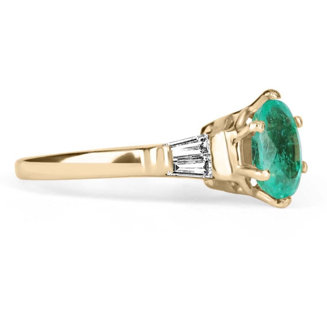 An extraordinary oval Colombian emerald and diamond ring. Crafted in gleaming 14K yellow gold, this ring features a vivacious, 2.13-carat natural oval Colombian emerald from the famous Muzo mines. Set in a secure six-prong setting, this emerald has