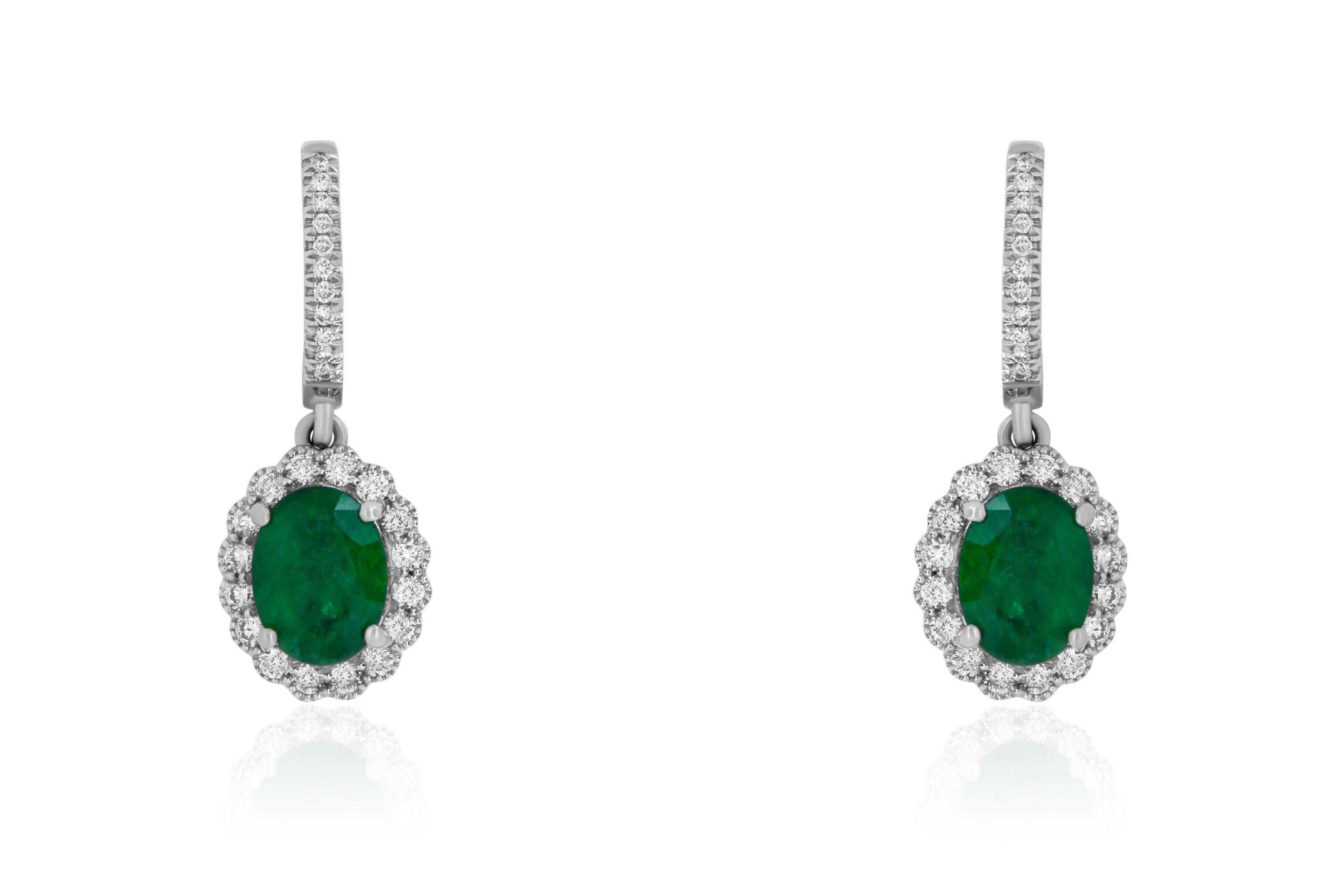 Contemporary White Gold Oval Shaped Emerald and White Diamond Halo Drop Earring For Sale