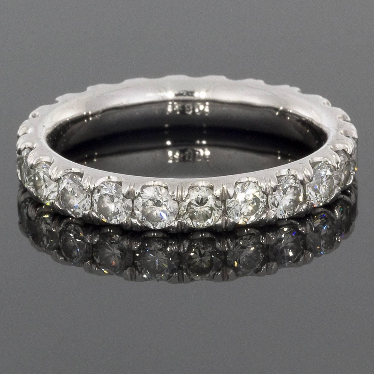 This classic band is a beautiful platinum diamond eternity band that can dress up any ring. It can be used as a wedding band, stand alone band, or stack ring. The ring has round brilliant cut diamonds that have a combined total weight of 2.37