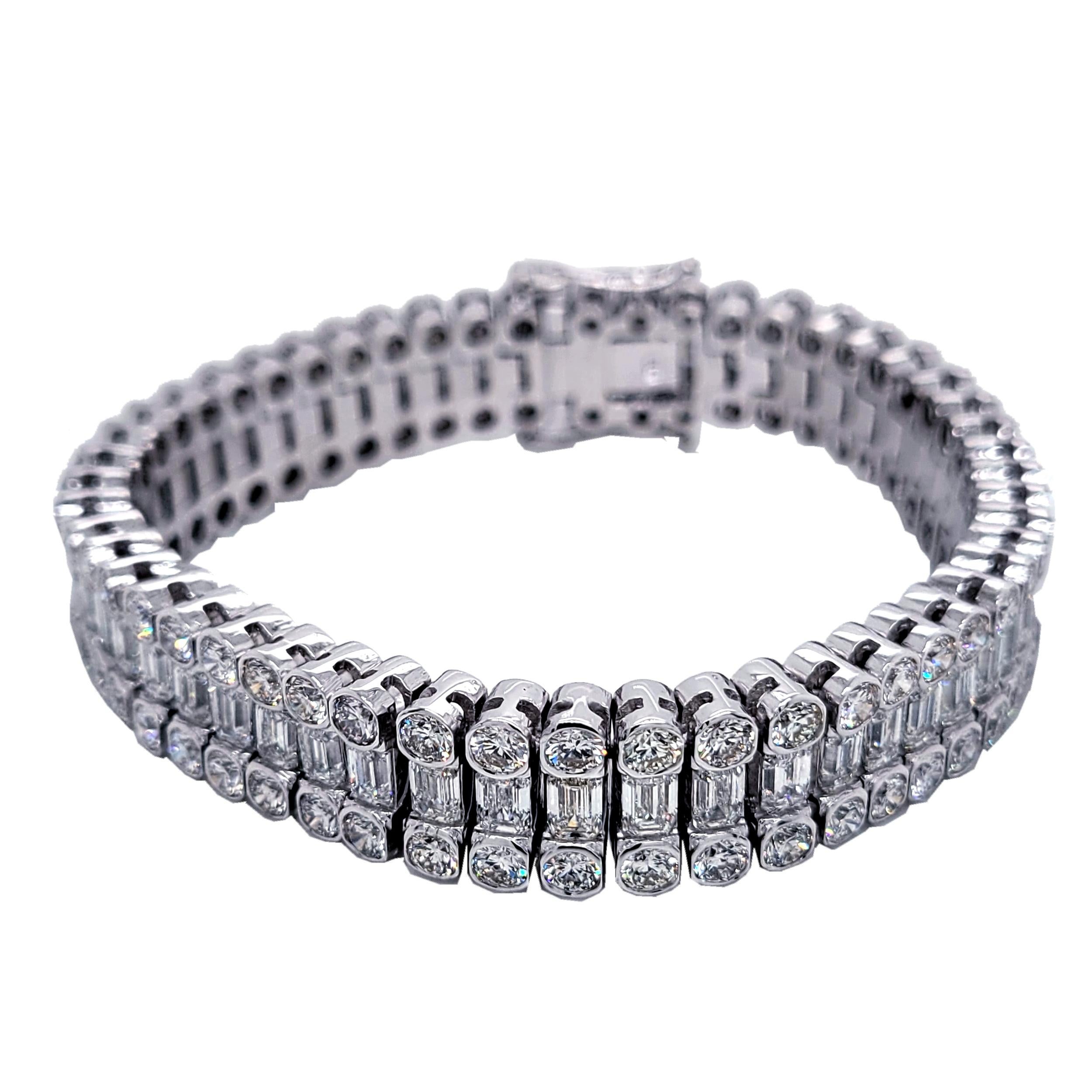This elegant Diamond Tennis Bracelet consists of 51 Links of Round Brilliant/ Emerald Cut diamonds set in 18K White Gold. It is 7 inch long and about 1/2 inch wide.  This bracelet is made by the highest quality craftsmanship making it extremely