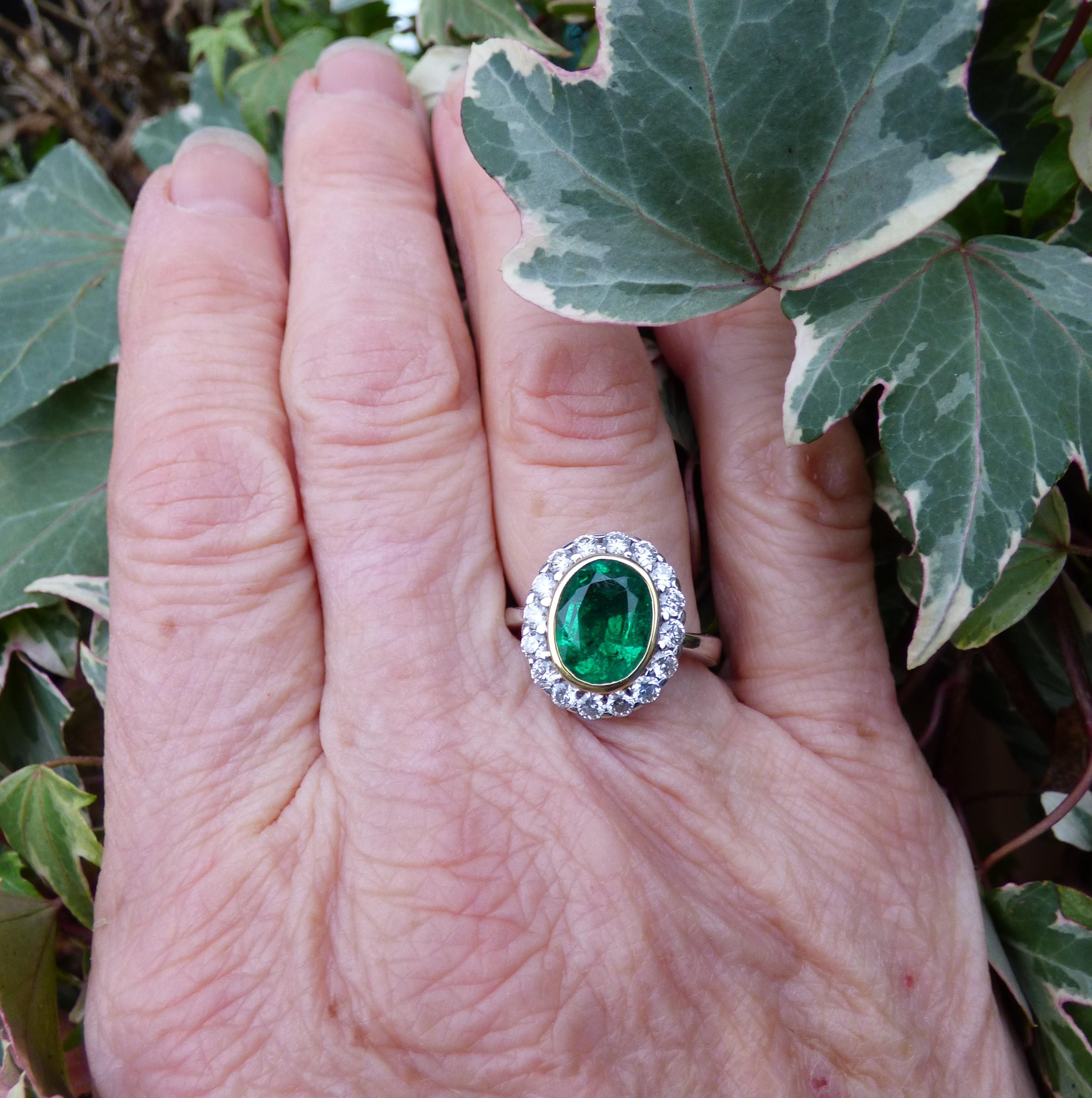 Contemporary 2.37ct. Oval Emerald and Diamond Ring in 18K Gold For Sale