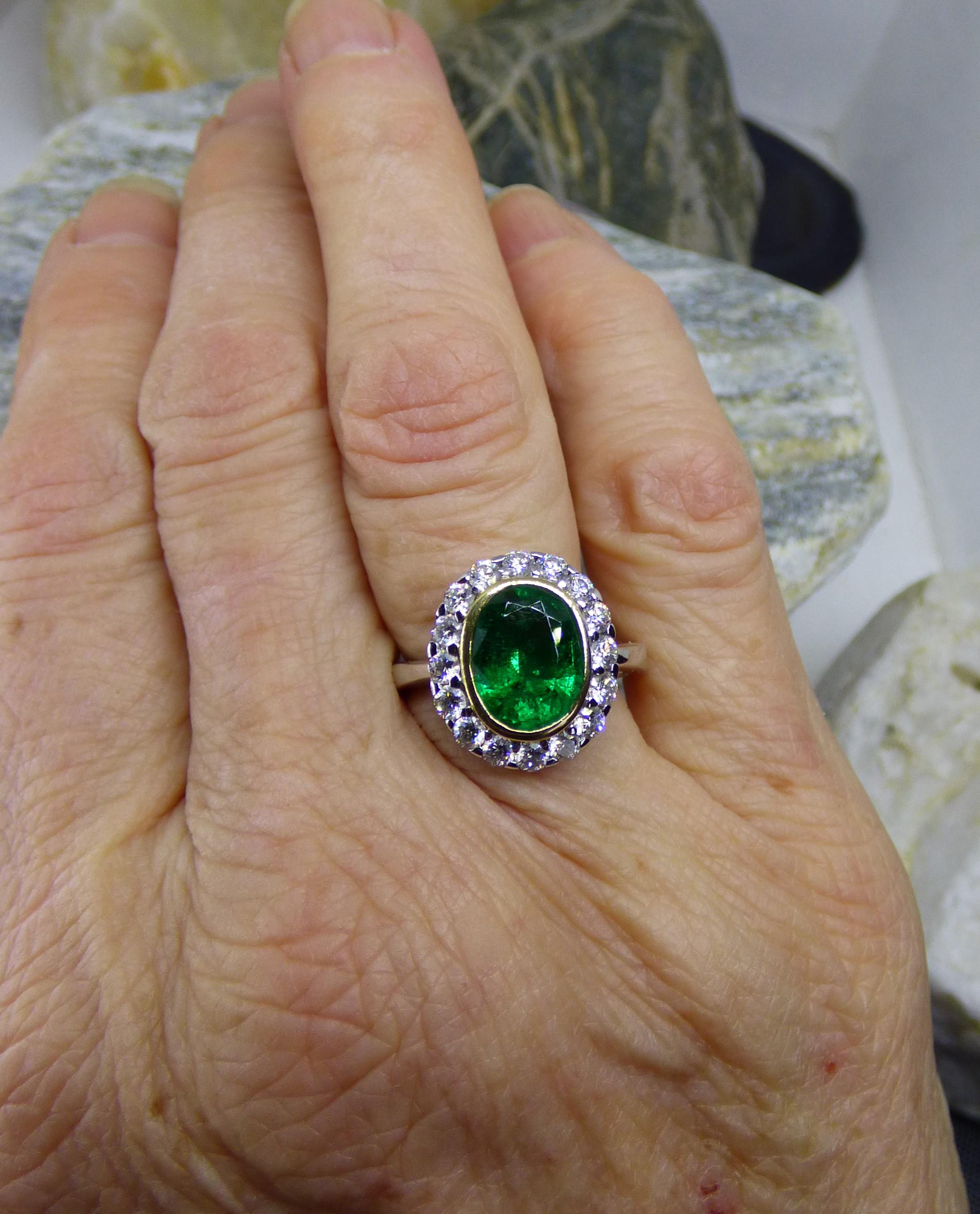 Oval Cut 2.37ct. Oval Emerald and Diamond Ring in 18K Gold For Sale