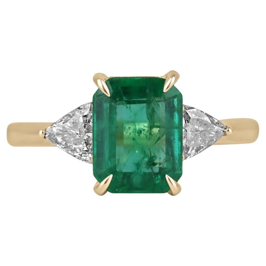 2.37tcw 18K Emerald Cut Emerald & Trillion Diamond Three Stone Ring