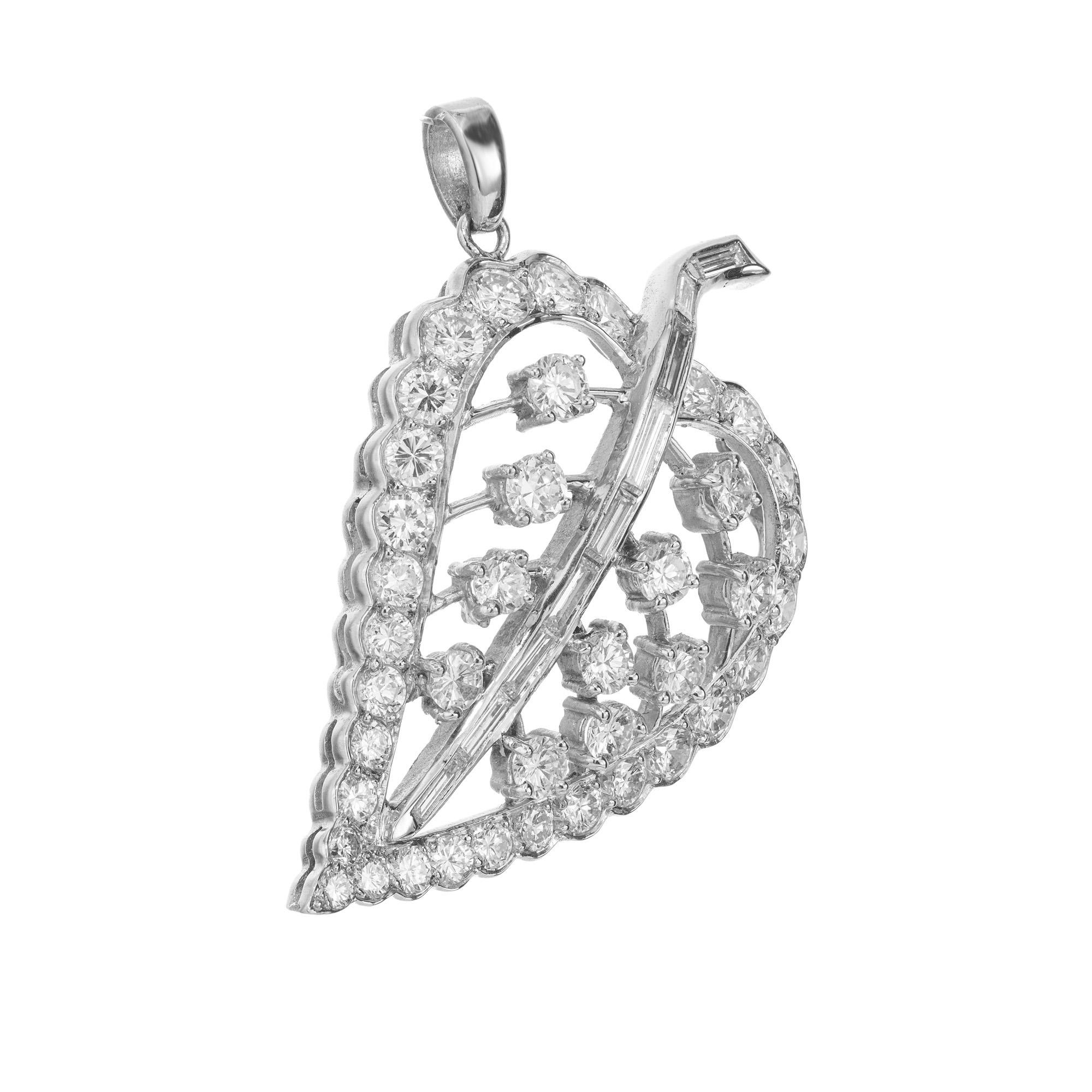Unveil elegance with this 1940's exquisite 2.38ct round and baguette Diamond platinum leaf pendant, a true masterpiece of luxury. Set with 9 straight baguette diamonds and 40 round brilliant cut diamonds. The glistening diamonds combine flawless