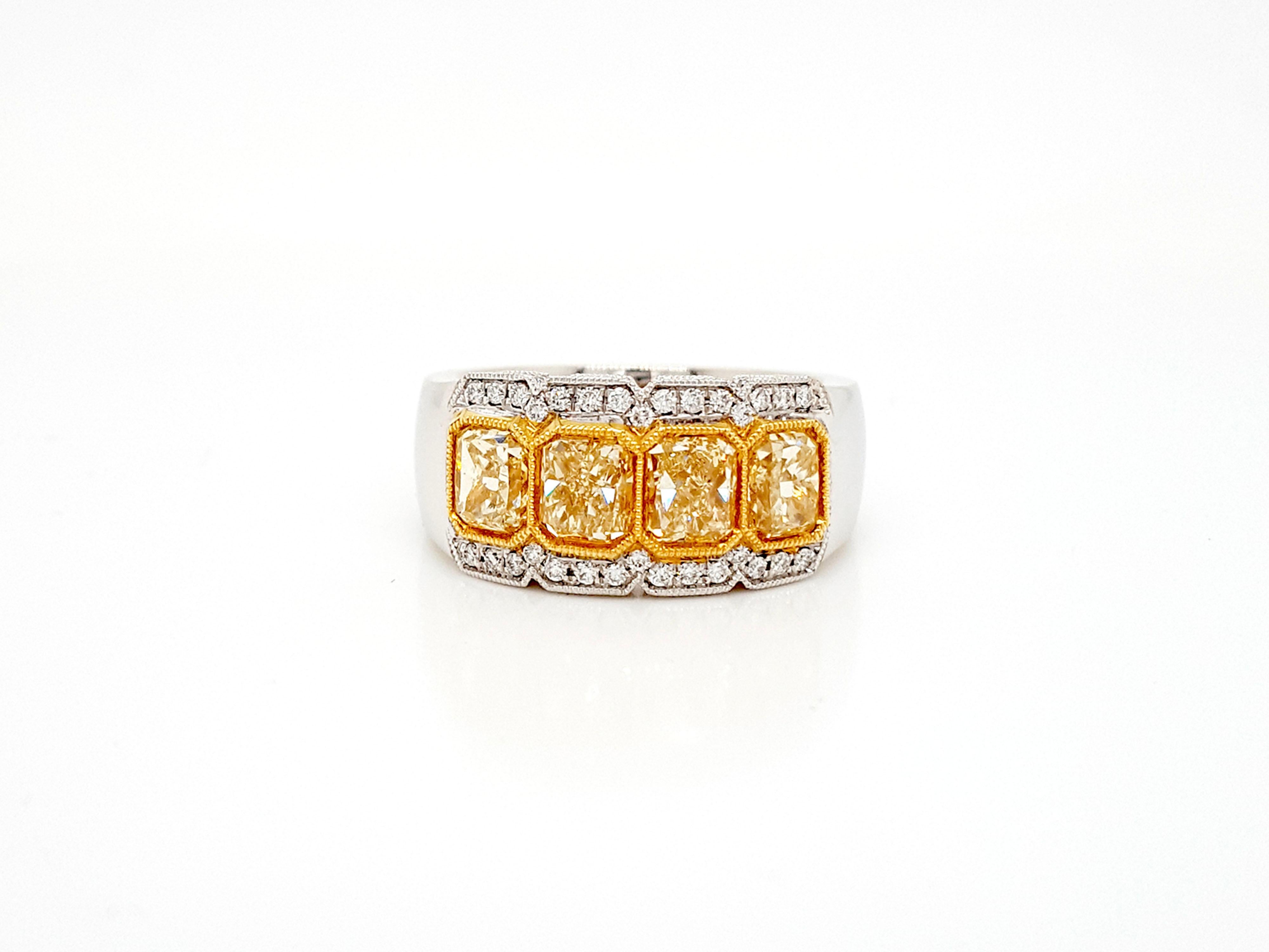 2.38 Carat Yellow Radiant Cut Four-Stone Diamond Ring in 18 Karat Gold. In New Condition For Sale In New York, NY