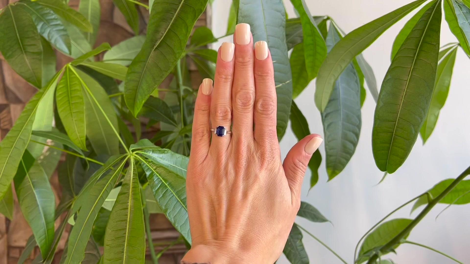 2.38 Carats Sapphire Diamond Platinum Three Stone Ring. Featuring one step cut sapphire weighing 2.38 carats. Accented by two diamonds with a total weight of approximately 0.20 carat, graded colorless, VS clarity. Crafted in platinum. Circa 2000