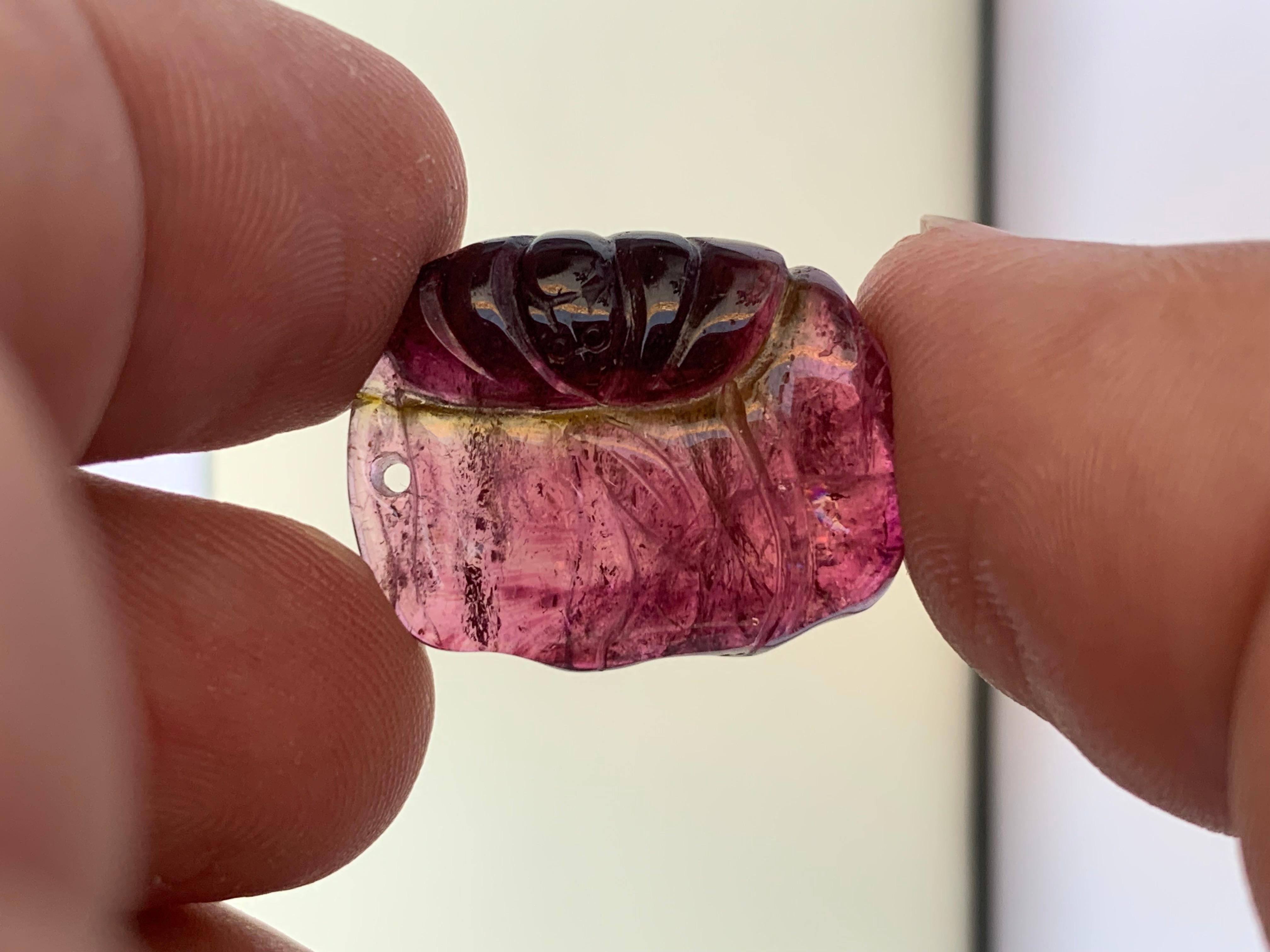 Stunning Loose Tri-Color Tourmaline Drilled Carving From Afghanistan
WEIGHT: 23.85 Carat
DIMENSIONS: 2.2 x 1.7 x 0.8 Cm
ORIGIN: Madagascar, Africa 
TYPE: Carving 
COLOR : Red, Green And Pink
TREATMENT: None

Tourmaline is an extremely