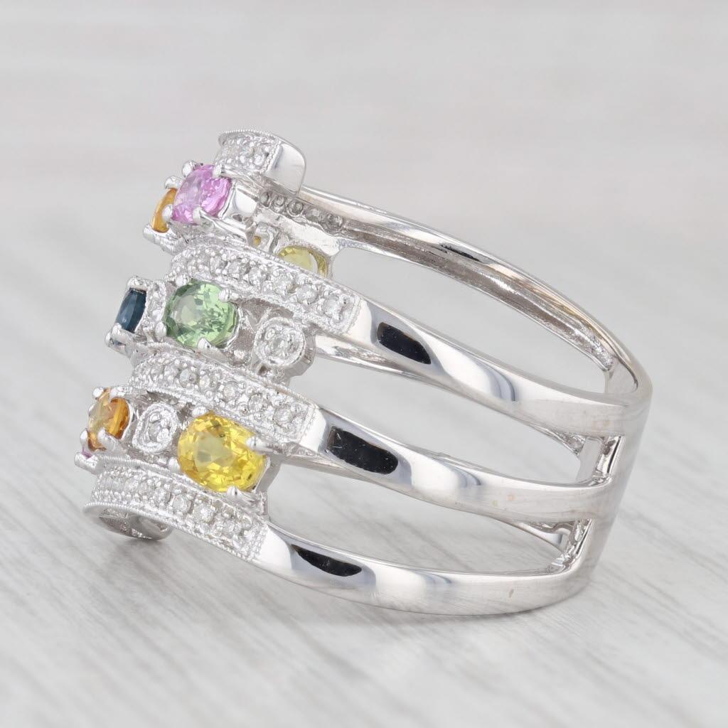 Gemstone Information:
- Natural Sapphires -
Total Carats - 2.20ctw
Cut - Oval Brilliant
Color - Yellow, Orange, Pink, Blue, Green
Treatment - Heated

- Natural Diamonds -
Total Carats - 0.18ctw
Cut - Round Brilliant / Single
Color - G - H
Clarity -