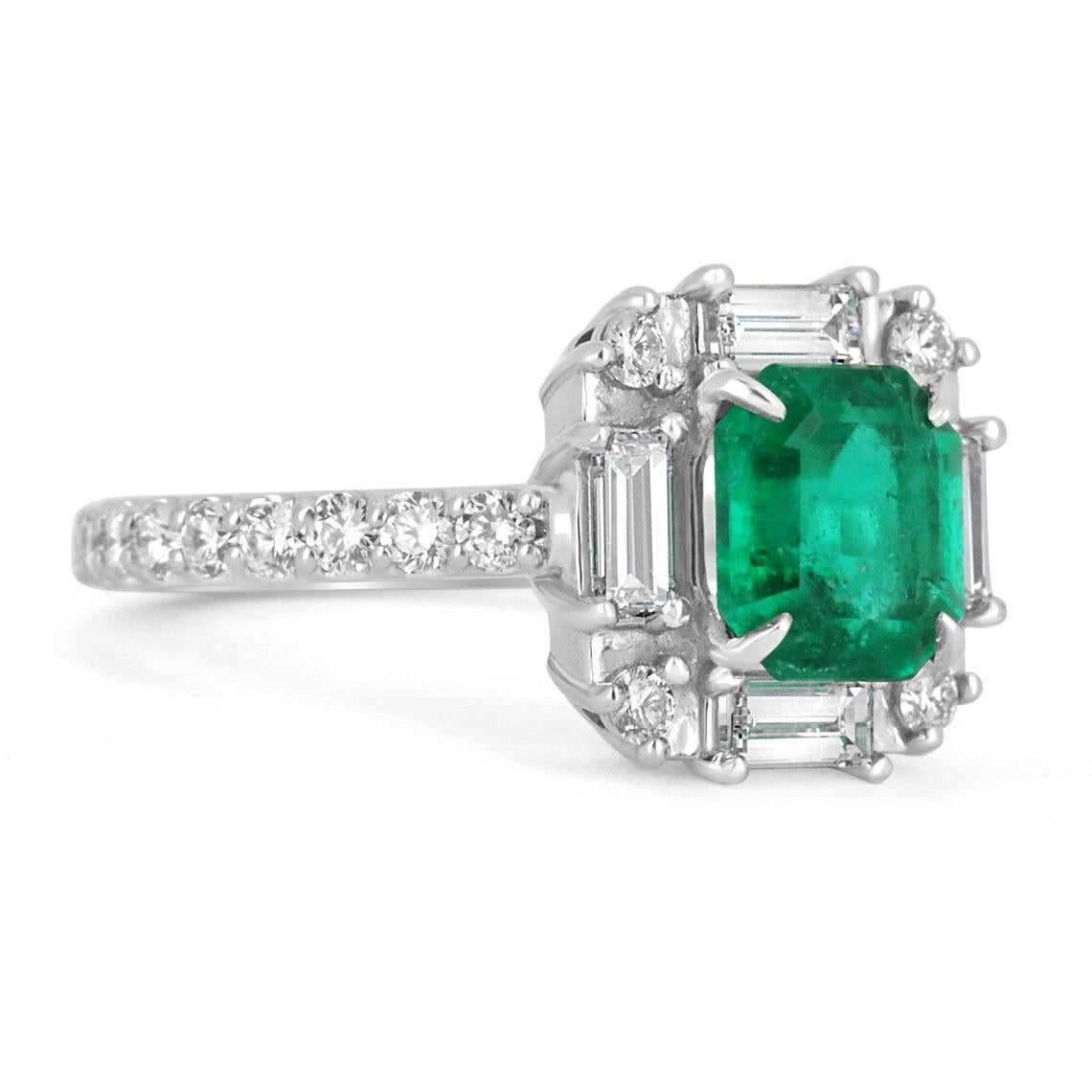 Featured is a remarkable emerald and diamond engagement ring. The center stone showcases a stunning, vivid dark green, AAA+ quality Asscher cut Colombian emerald with excellent luster. Impressive eye clarity, with minimal imperfections seen within