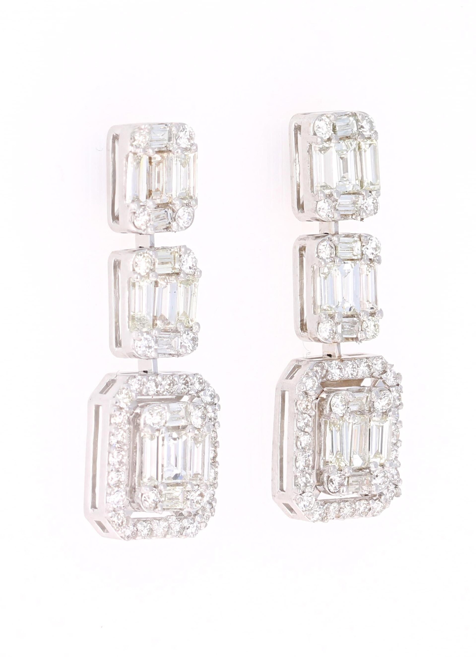 2.39 Carat Baguette Cut and Round Cut Diamonds Dangling 18 Karat White Gold Earrings

These unique & intricate design earrings are sure to make a stunning statement! There are 30 Baguette Cut Diamonds that weigh 2.01 Carats and 24 Round Cut Diamonds