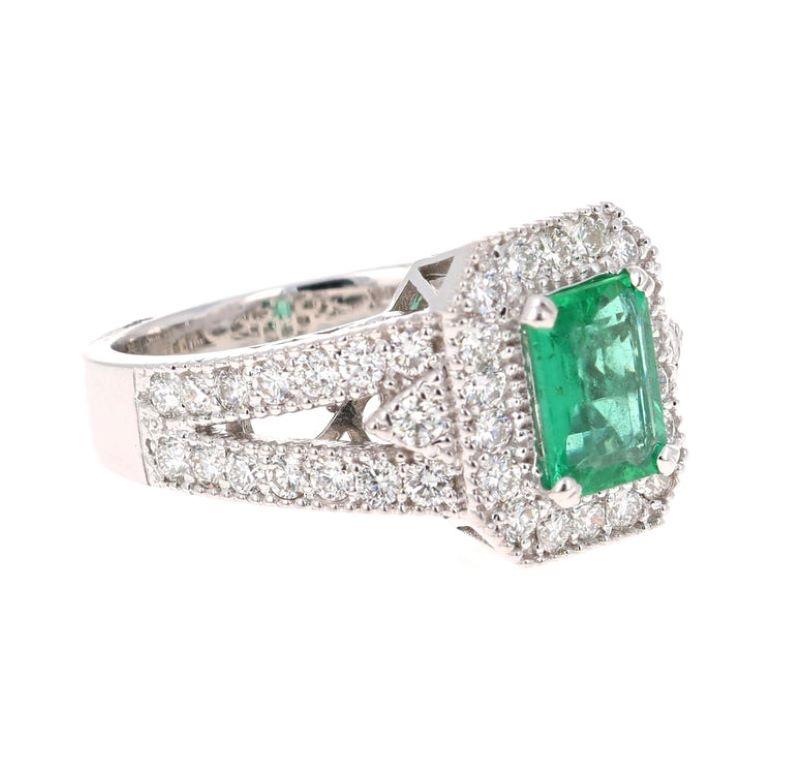 Stunning Art-Deco Inspired Emerald Cut Emerald Diamond Ring! This Emerald ring is absolutely gorgeous. The center is an Emerald cut Emerald which weighs 1.17 carats and measures in at 6mm x 8 mm. The Emerald is surrounded by 48 Round Cut Diamonds