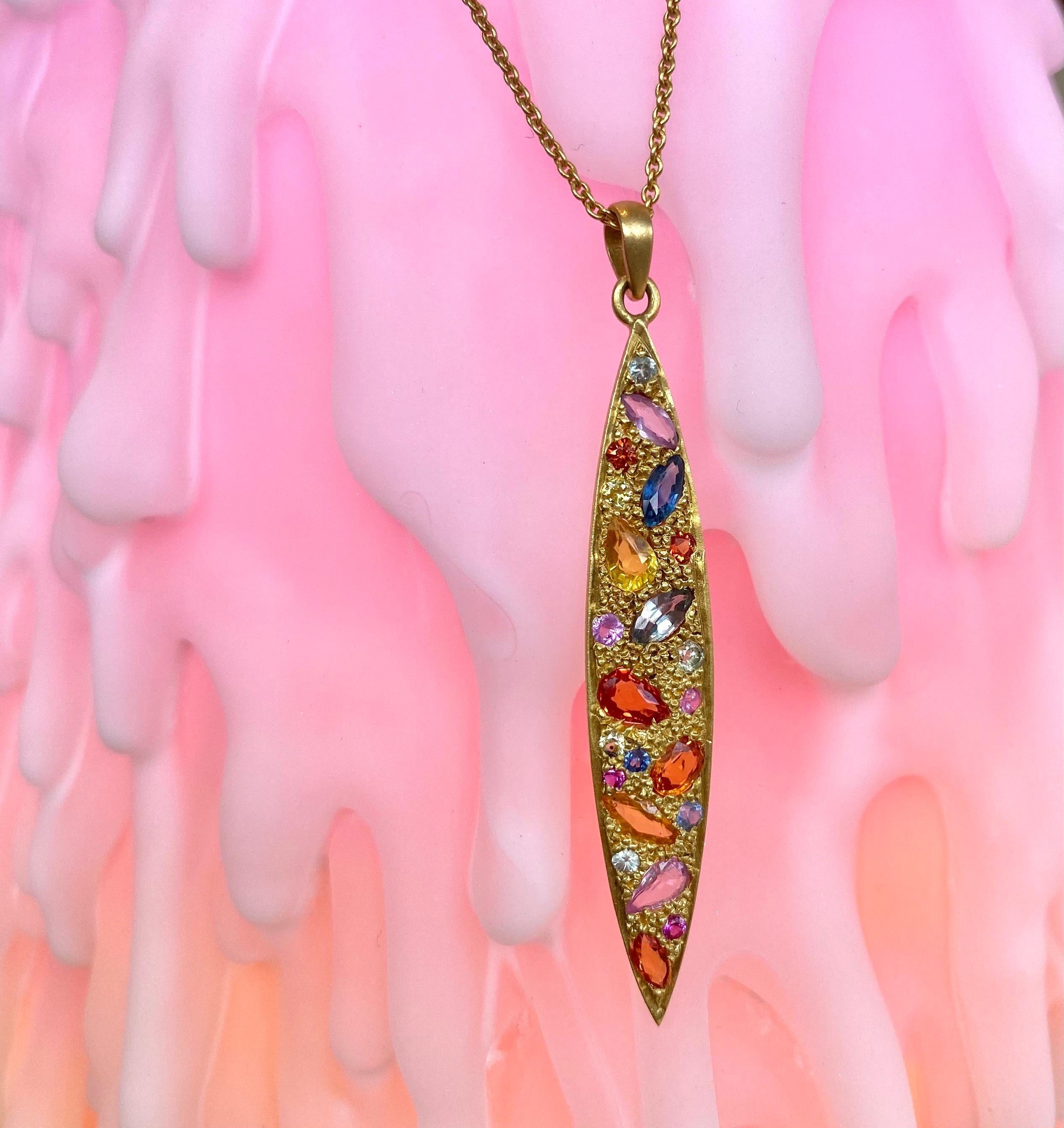 Designed by Award Winning jewelry designer, Lauren Harper, this brilliantly colorful Sapphire and 18kt Gold pendant has 2.39 carats of pink, orange, blue and yellow sapphires. This pendant goes with absolutely anything in your closet. Beautiful warm