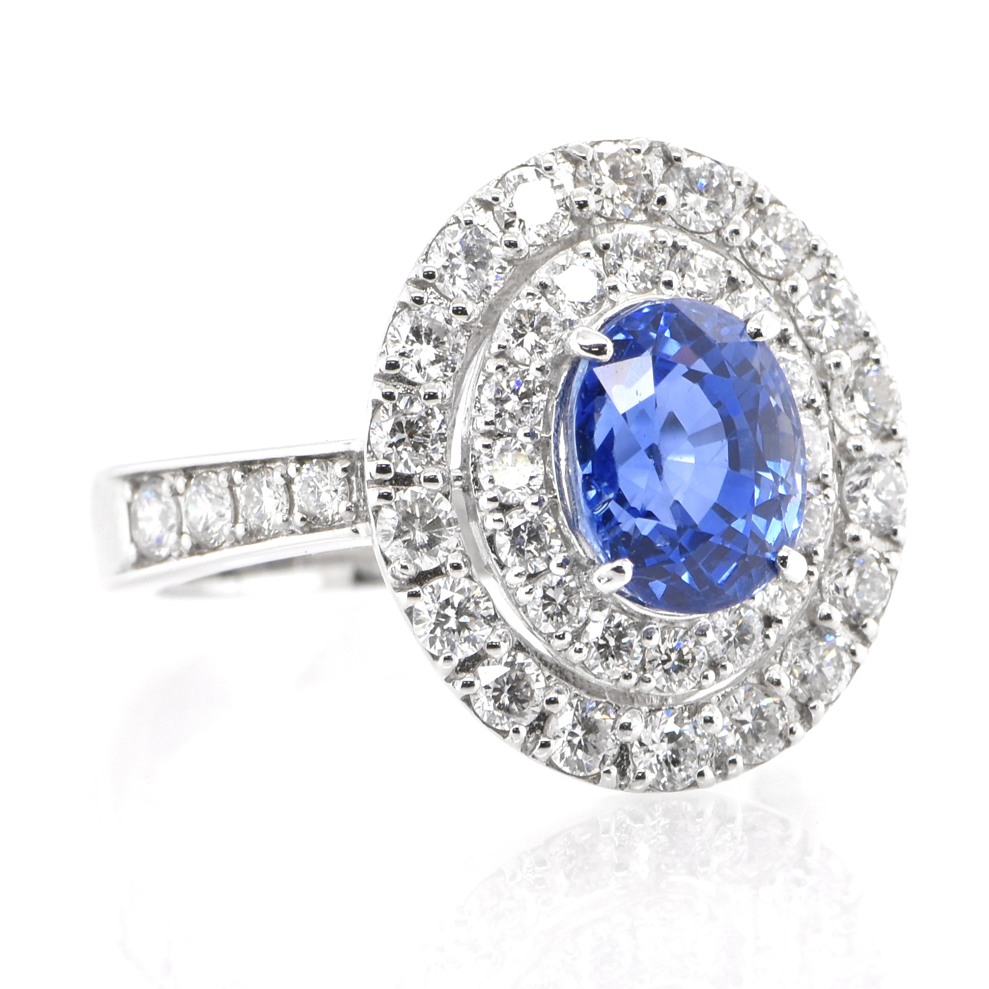 Modern 2.39 Carat Natural Blue Sapphire and Diamond Double Halo Ring Made in Platinum