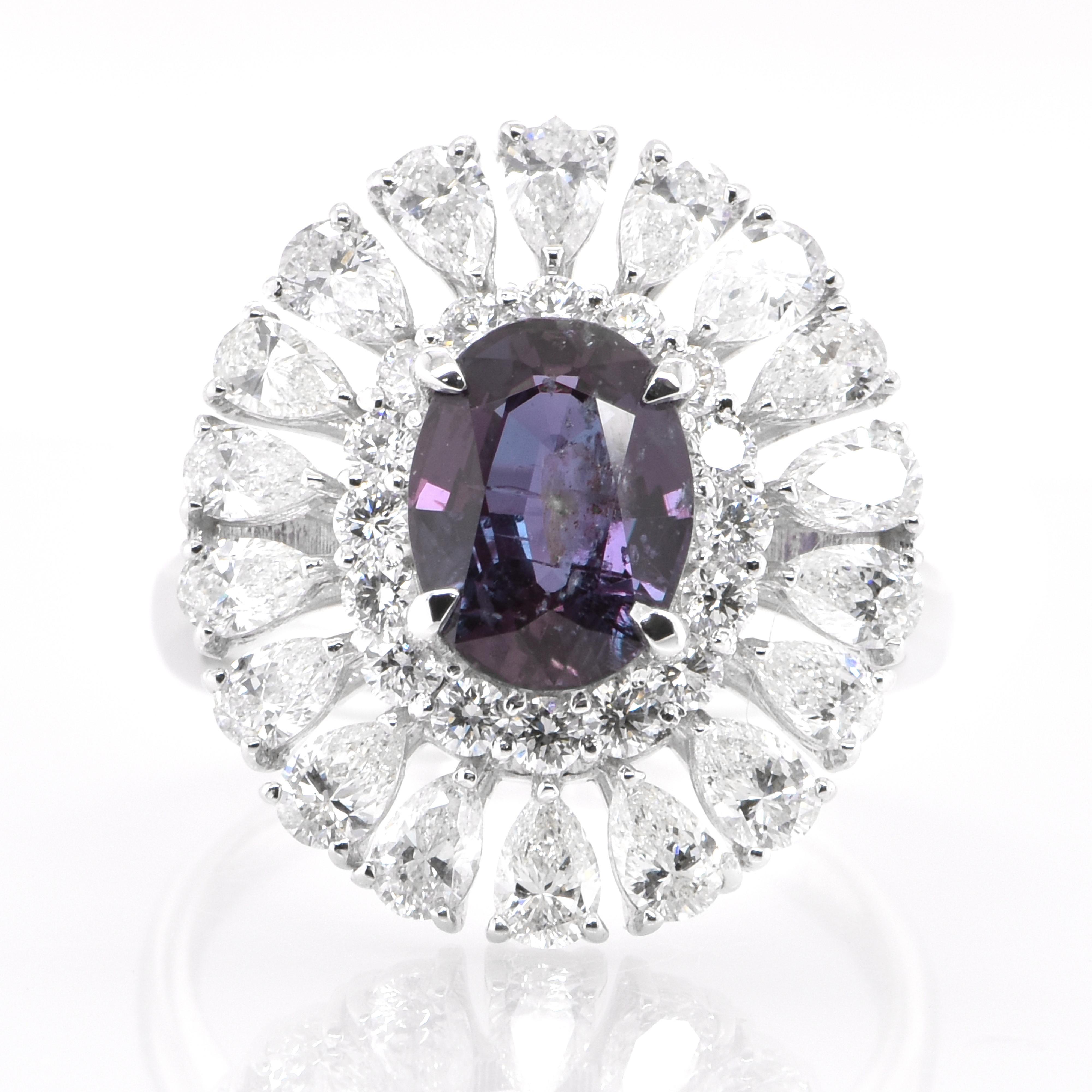 A gorgeous ring featuring a 2.39 Carat, Natural Brazilian Alexandrite and 2.06 Carats of Diamond Accents set in Platinum. Alexandrites produce a natural color-change phenomenon as they exhibit a Bluish Green Color under Fluorescent Light whereas a