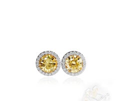 2.39 Carat Natural Fancy Light Yellow & White Diamond Stud Earrings, 18K Gold.