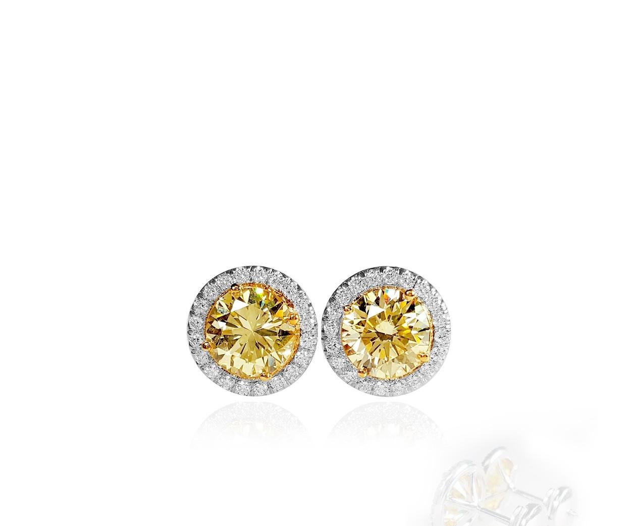 Contemporary 2.39 Carat Natural Fancy Light Yellow & White Diamond Stud Earrings, 18K Gold. For Sale