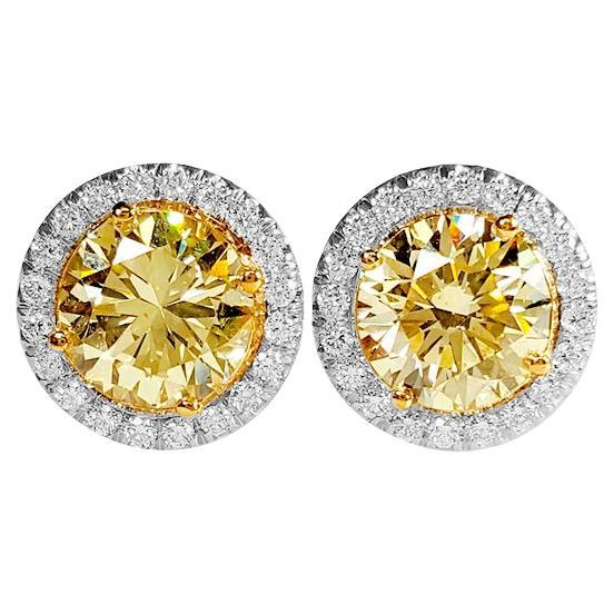 2.39 Carat Natural Fancy Light Yellow & White Diamond Stud Earrings, 18K Gold.