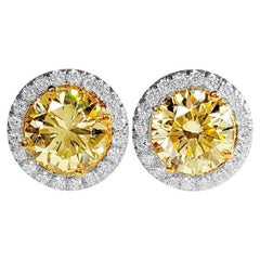2.39 Carat Natural Fancy Light Yellow & White Diamond Stud Earrings, 18K Gold.