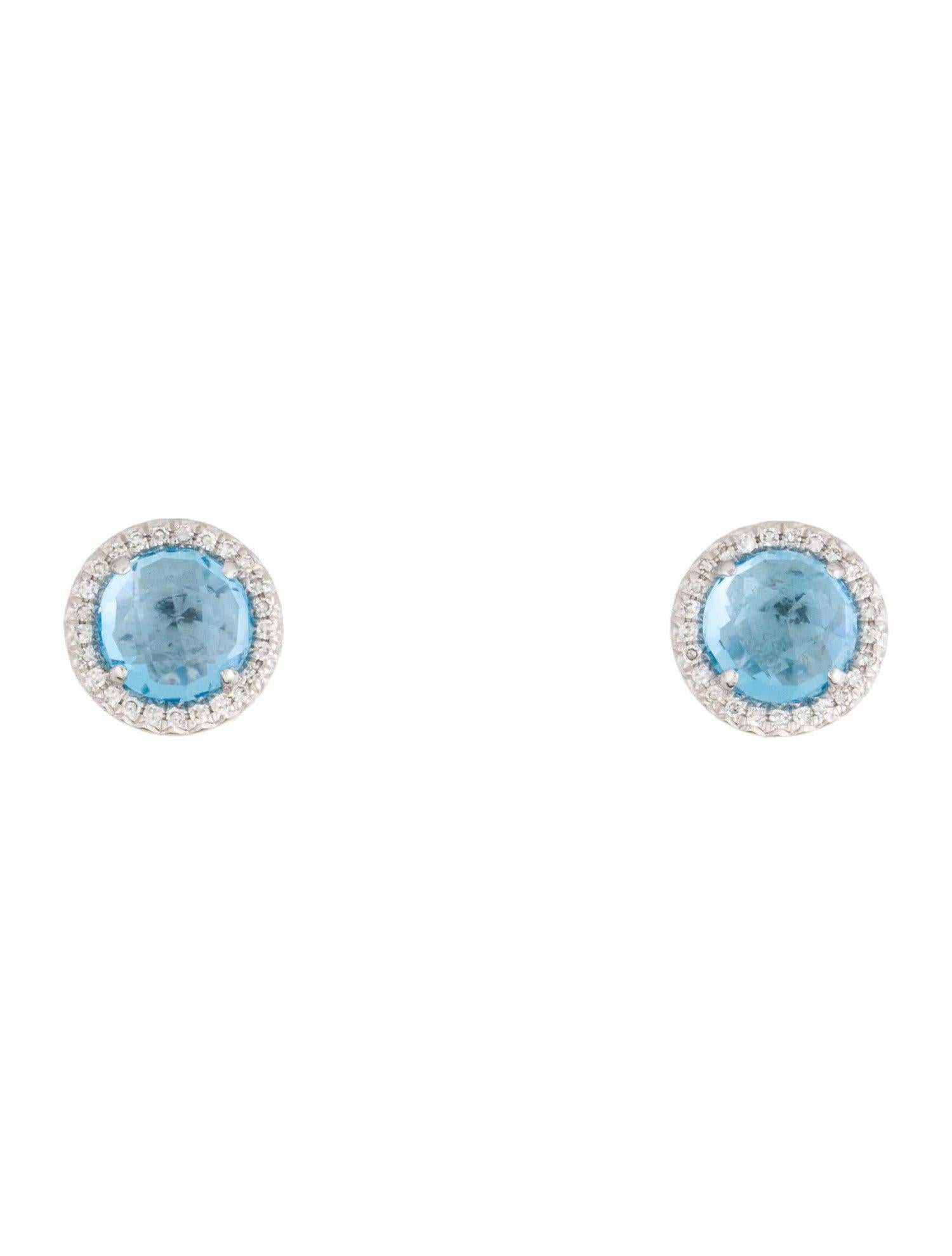 These Swiss Blue Topaz & Diamond Earrings are a stunning and timeless accessory that can add a touch of glamour and sophistication to any outfit. 

These earrings each feature a 1.20 Carat Round Swiss Blue Topaz, with a Diamond Halo comprised of
