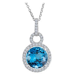 2.39 Ct London Blue Topaz and 0.16 Carat Diamond Halo 14 Karat Gold