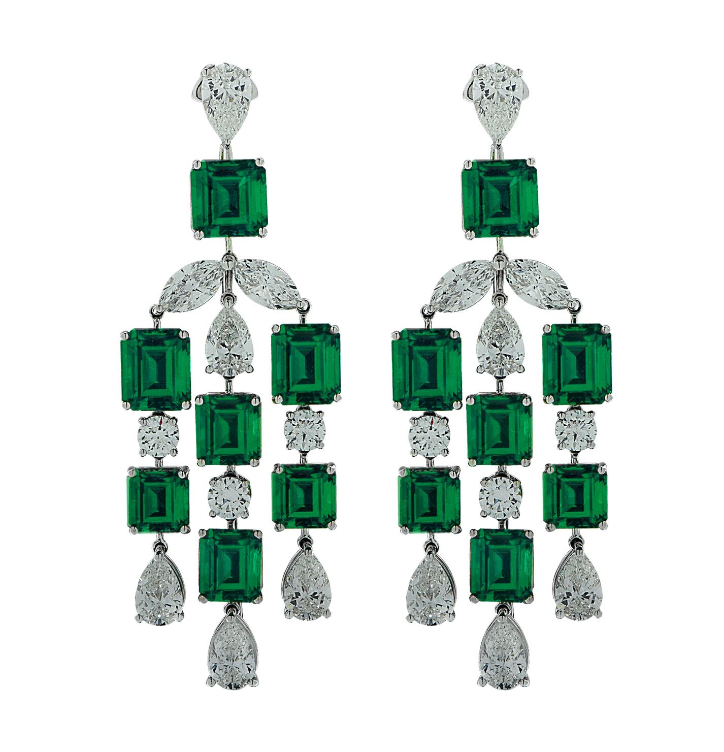 Exquisite diamond and emerald dangle earrings finely crafted in platinum, showcasing 14 emerald cut emeralds weighing approximately 23.92 carats total and 20 certified round brilliant, marquise cut and pear shape diamonds weighing approximately