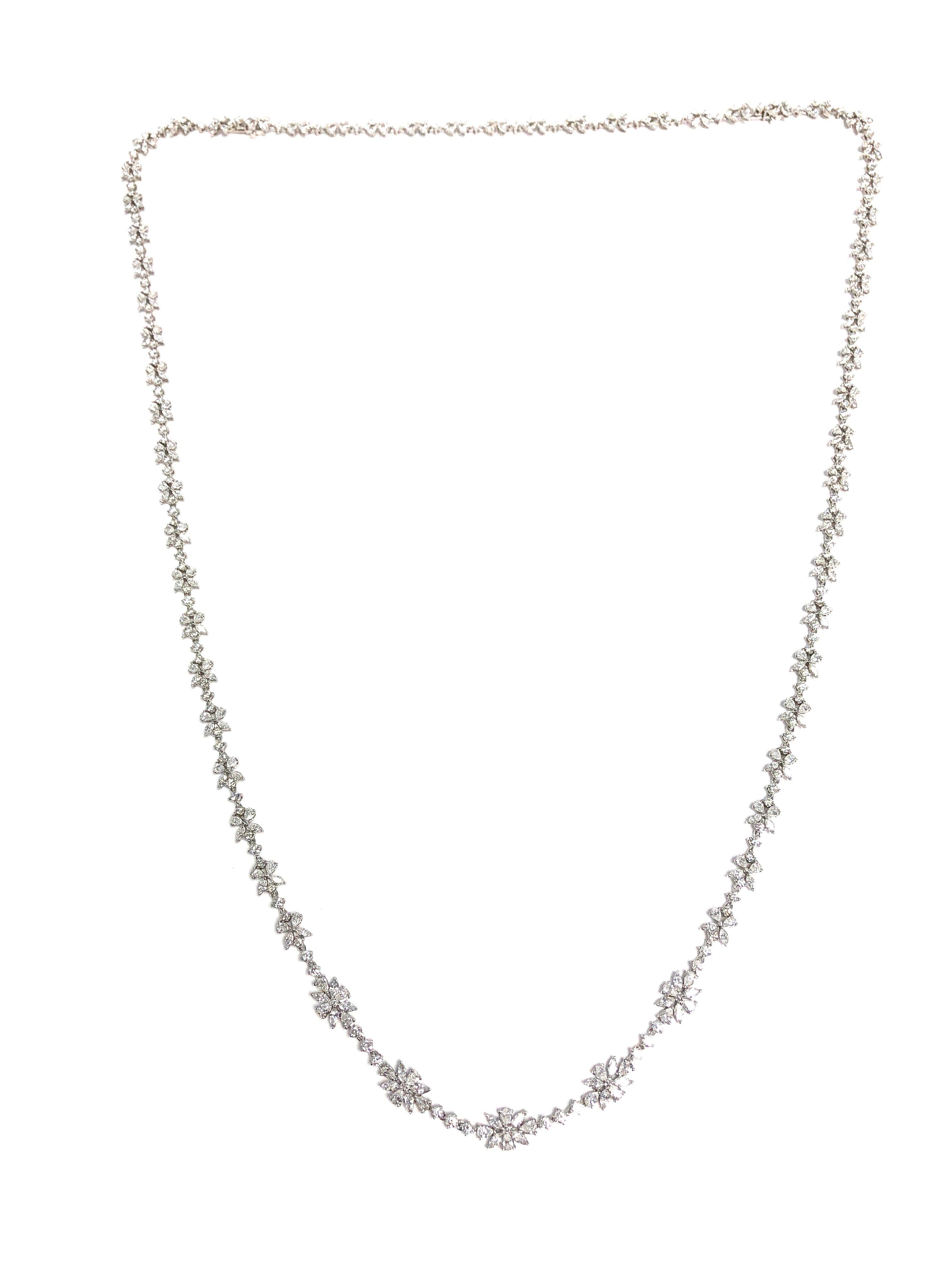 This stunning necklace features a combination of marquise, pear, and round white diamonds to form a beautiful endless flower design. This necklace is secured with a hidden clasp and safety lock, and is set in 18k white gold. 

This necklace is 37