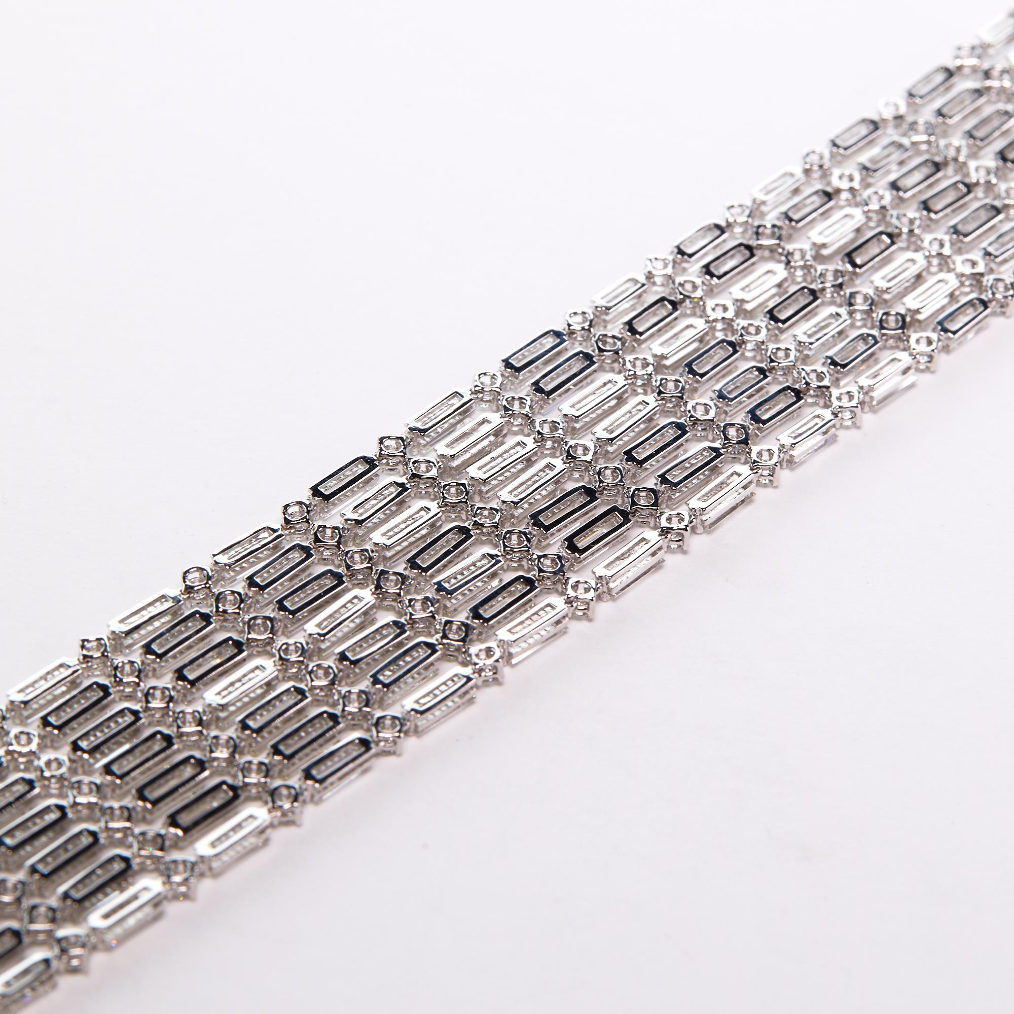 Diamond Modern Bracelet.  This stunning modern Bracelet has 18.62 carats of baguette diamonds and 5.68 carats of round brilliant diamonds, E-F color, VVS clarity. We source each of the stones and then work with artisans all over the world to achieve