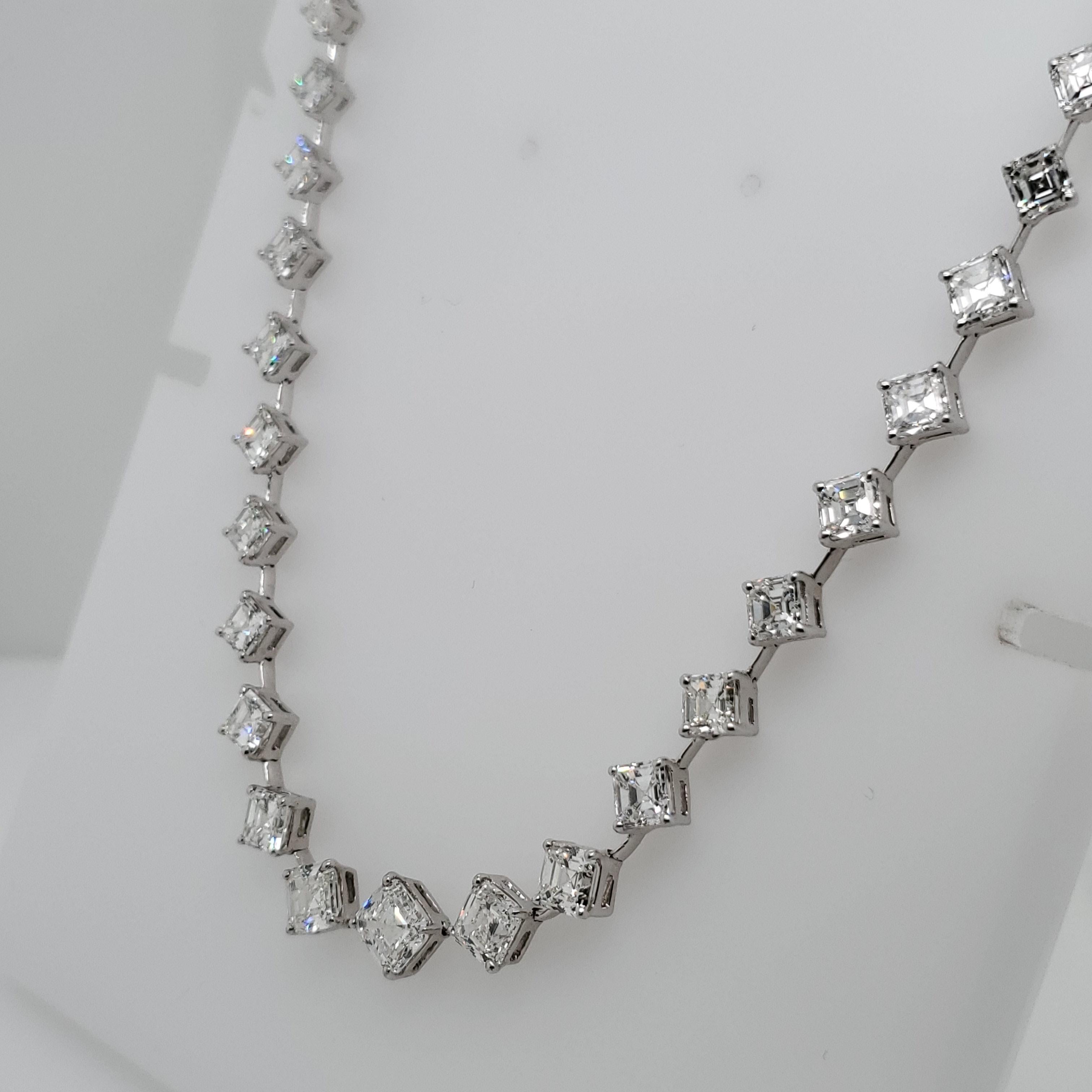 We cut each of the 49 Asscher cut diamonds in this necklace to match exactly.  Set in platinum and average color and quality of G VS2 weighing a total of 23.97 carats. 
