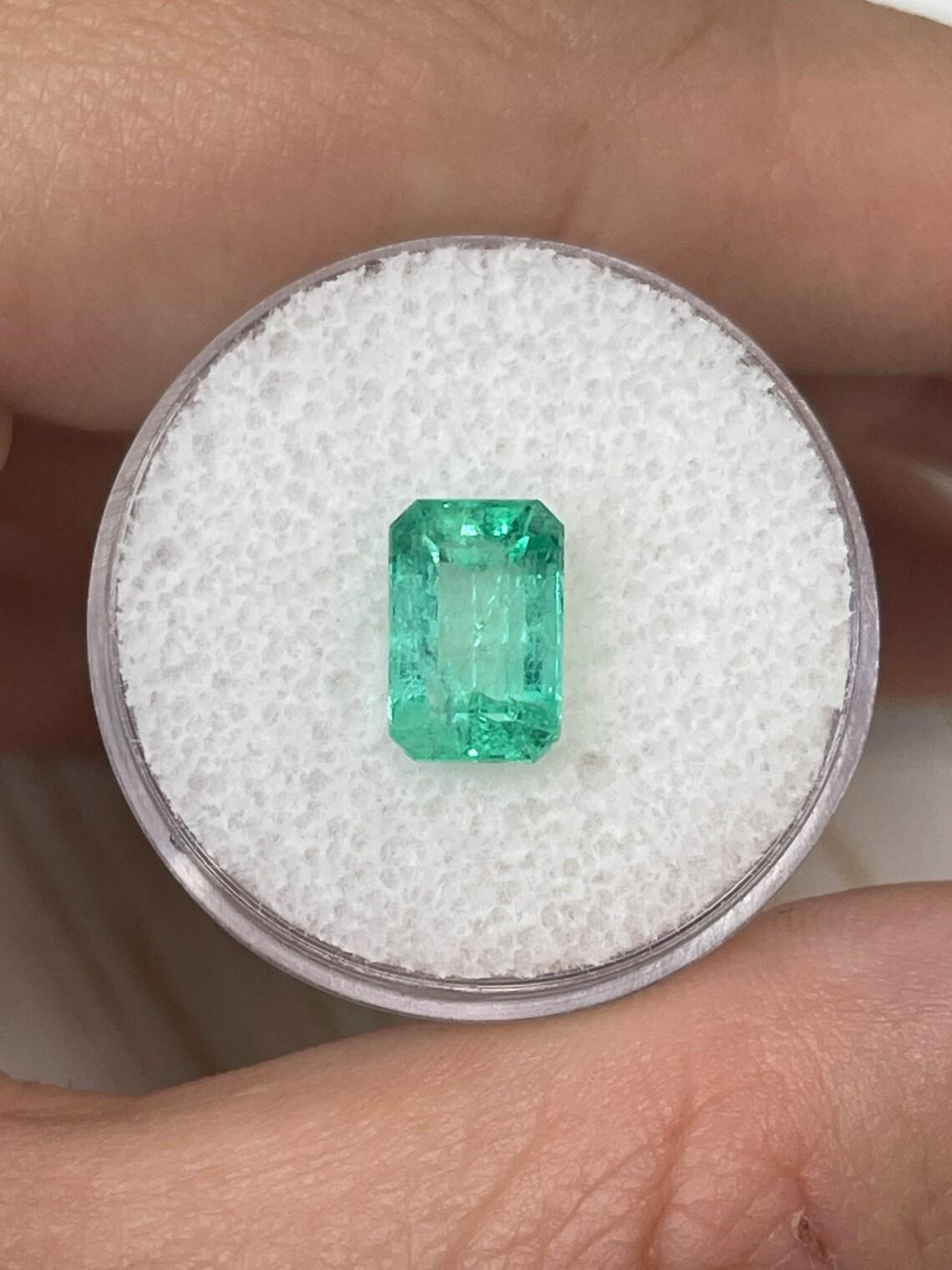 Stone: Emerald
Weight: 2.39-carats
Shape: Emerald Cut
Clarity: Transparent
Luster: Very Good
Color: Spring Green
Measurements: 9.61mm x 6.35mm x 5.02mm
Geographic Origin: Colombia
Treatment: Natural, Oiling

Comments: Due to their growth conditions