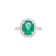 2.39ct Oval Emerald and Diamond Halo 18 Carat White Gold Cluster Engagement Ring