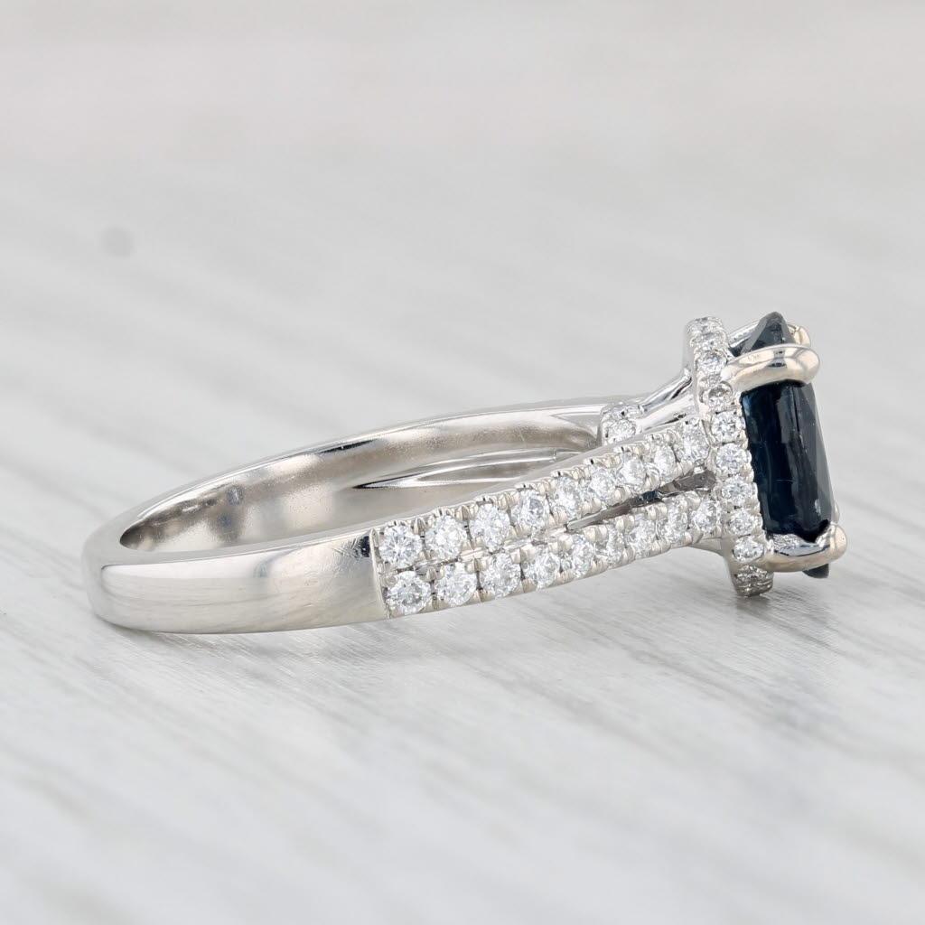 Gemstone Information:
- Natural Sapphire -
Carats - 1.95ct
Cut - Oval
Color - Dark Blue
Treatment - Heated

- Natural Diamonds -
Total Carats - 0.44ctw
Cut - Round Brilliant
Color - F - H
Clarity - VS2

Metal: 18k White Gold
Weight: 5.2 Grams
