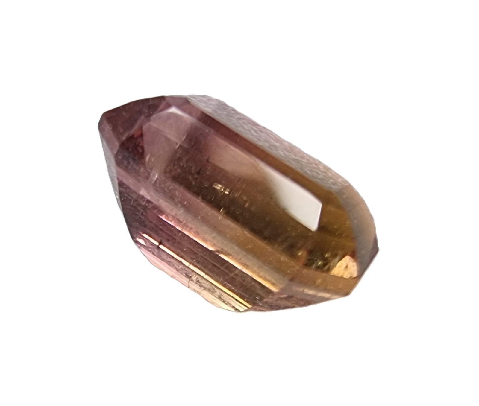 Watch your jewelry creation pop with this truly unique rich and captivating  2.3ct Emerald Cut Bi-color Brown and Pink Rubellite Loose Gemstone. 

Gemstone Details:
Carat Weight: 2.3 carats
Shape: Emerald Cut
Variety: Bi-Color Brownish Pink
