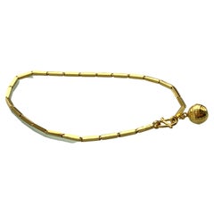 23ct Gold Globe Charm Bracelet 3.82 Grammes