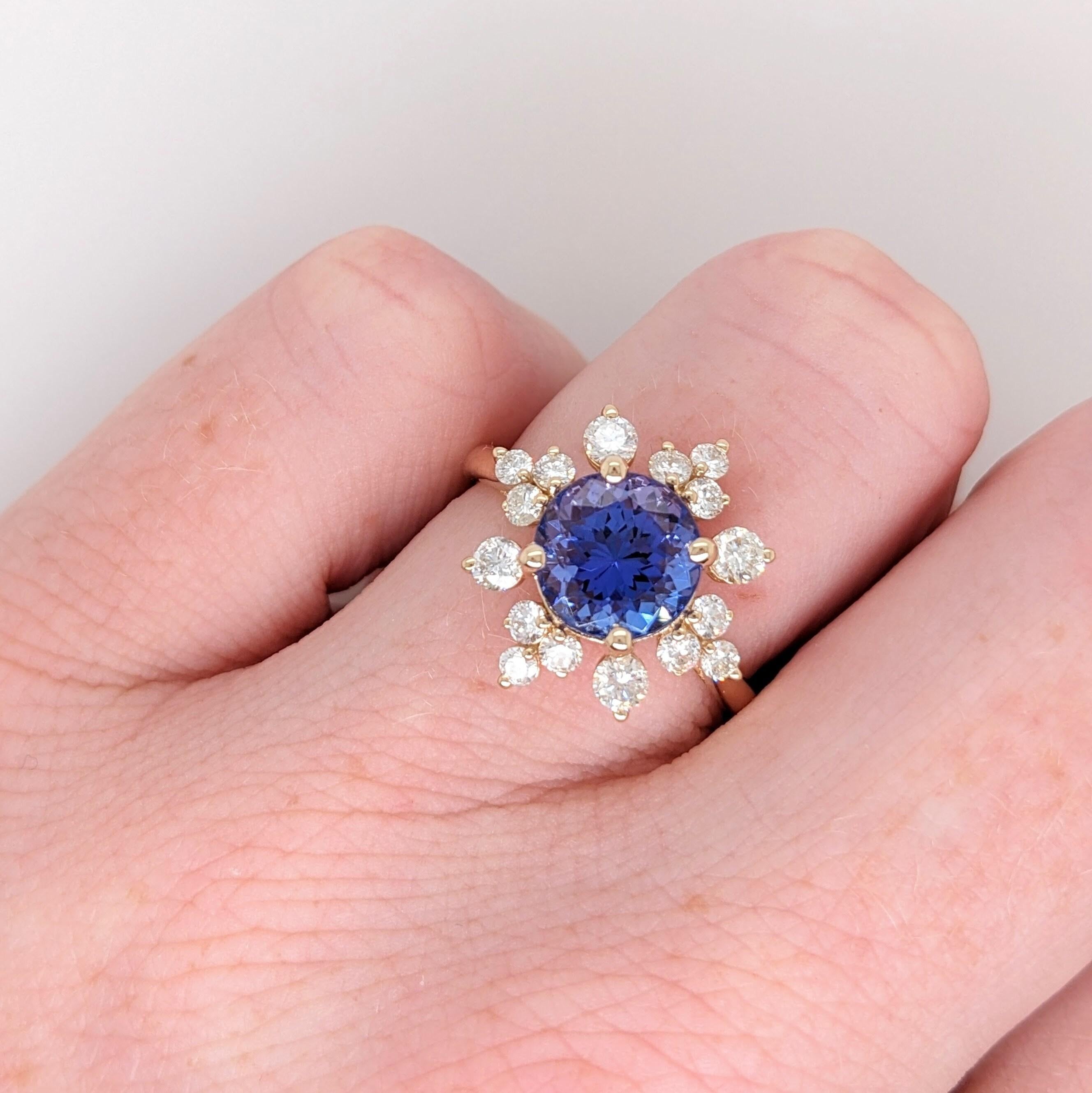 This sparkling white and blue ring is perfect for the modern bride or for 5th and 45th anniversaries! It is also a great statement piece for the holidays coming up with it's snowflake inspired halo! With a straight band you can ensure that this ring